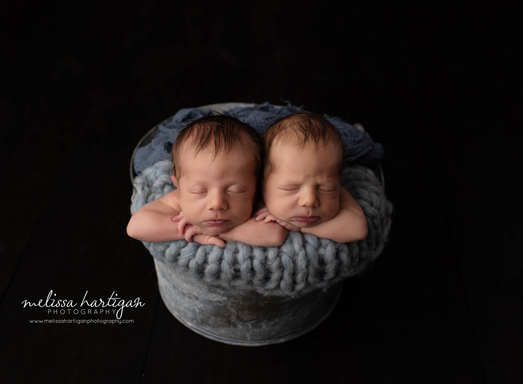 twin boys posed in metal bucket studio newborn photography pose South Windsor CT newborn Photographer
