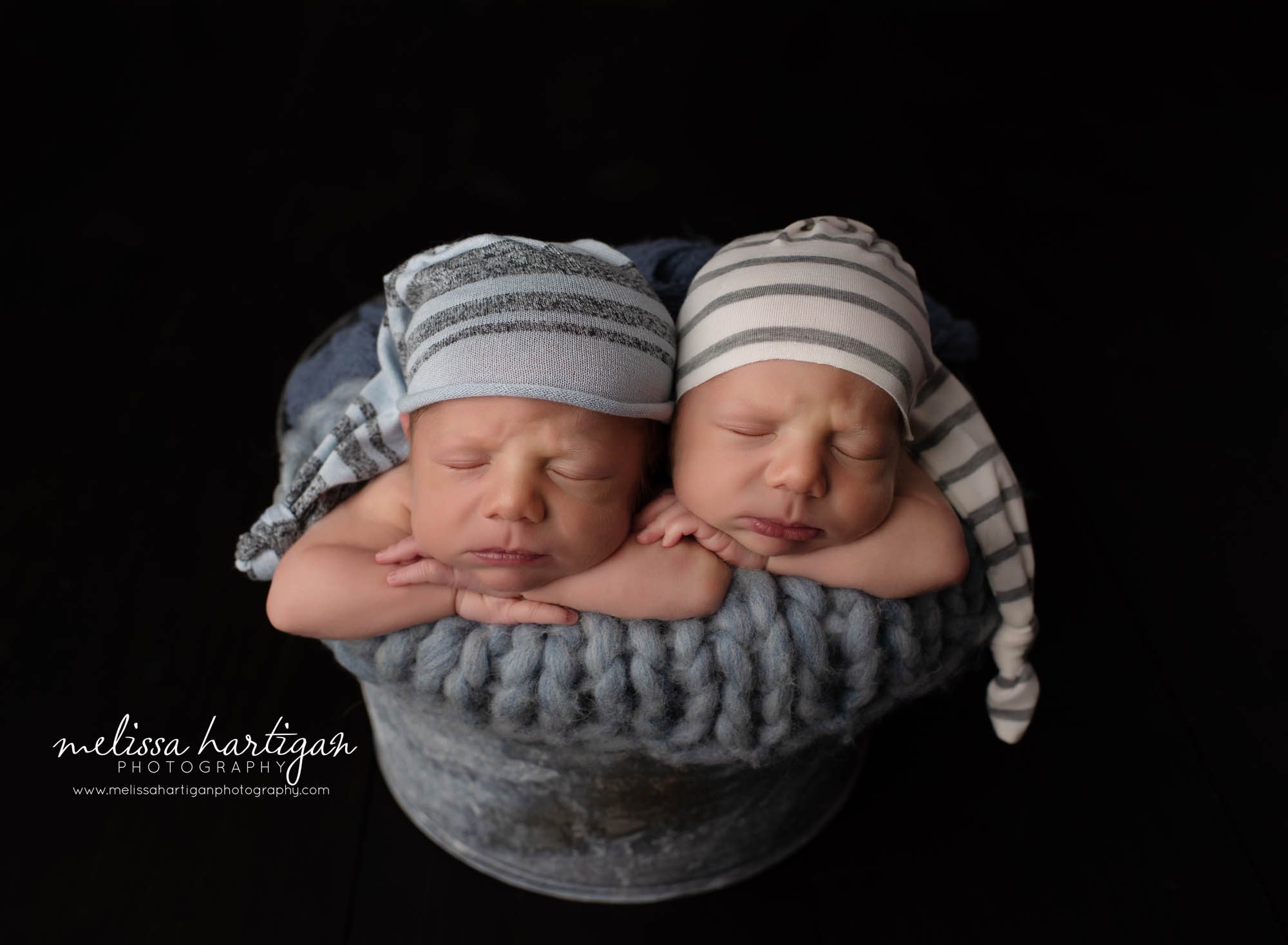 twin boys posed in metal bucket studio newborn photography pose South Windsor CT newborn Photography