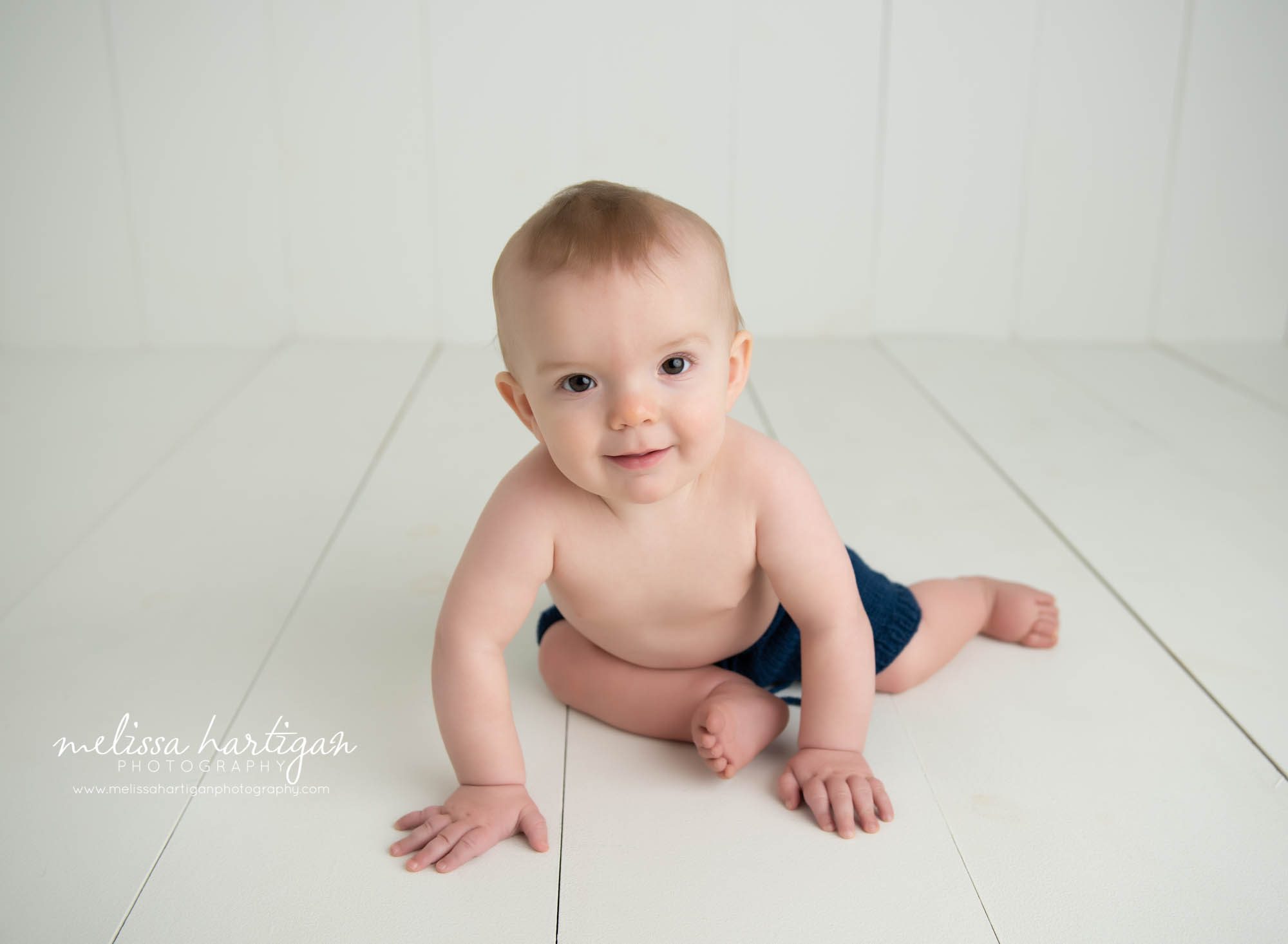 baby boy sitting wooden boards baby milestone photography CT