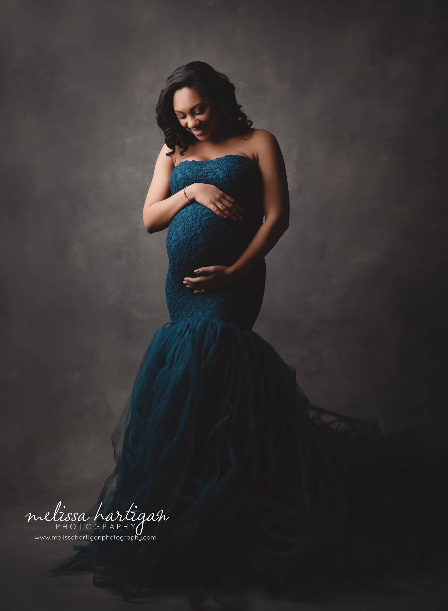 stunning pregnant mom holding baby bump studio maternity session CT maternity Photography New Britain