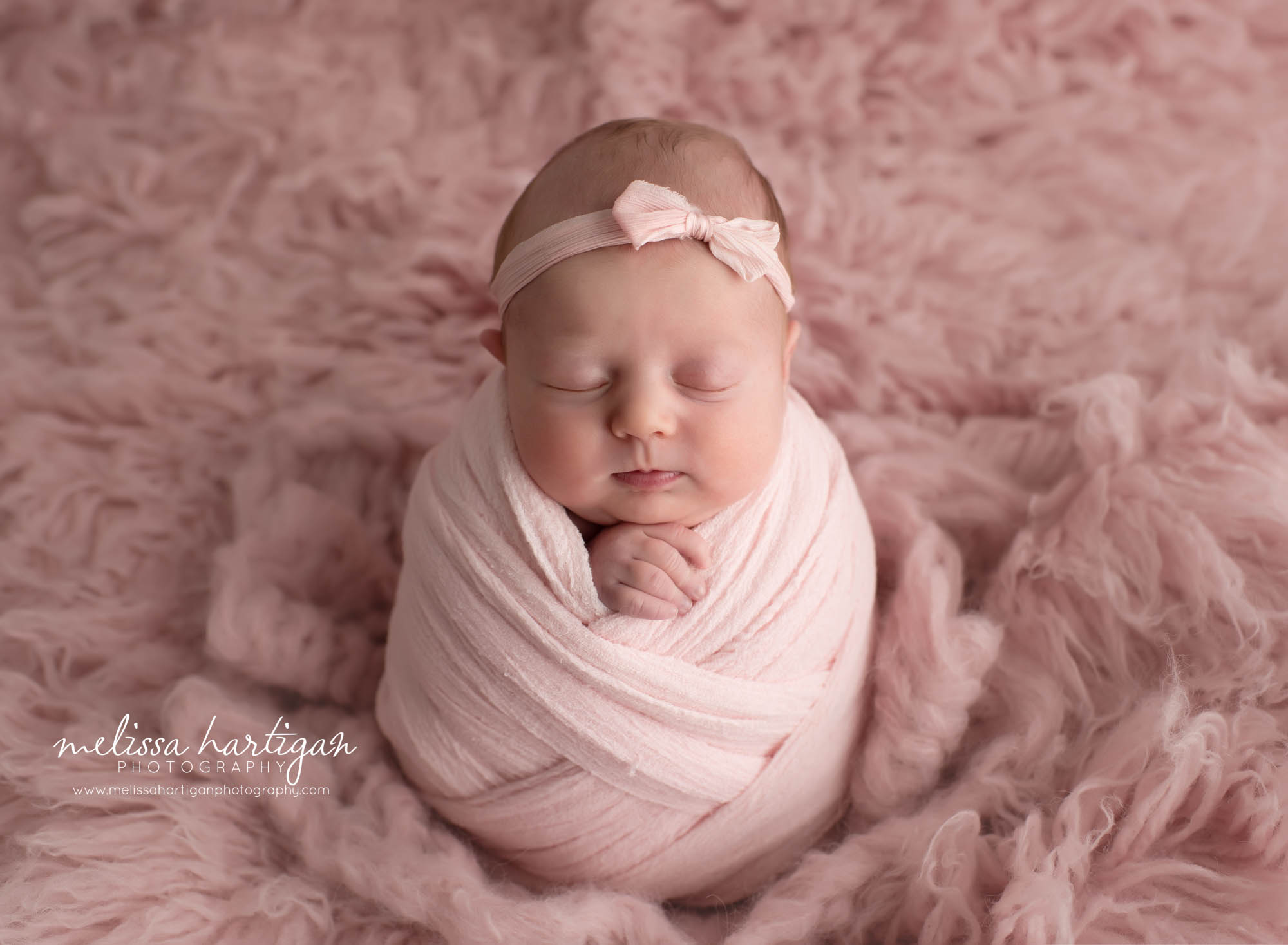 newborn baby girl wrappe din pink wrap with matching pink bow headband coventry ct newborn photography