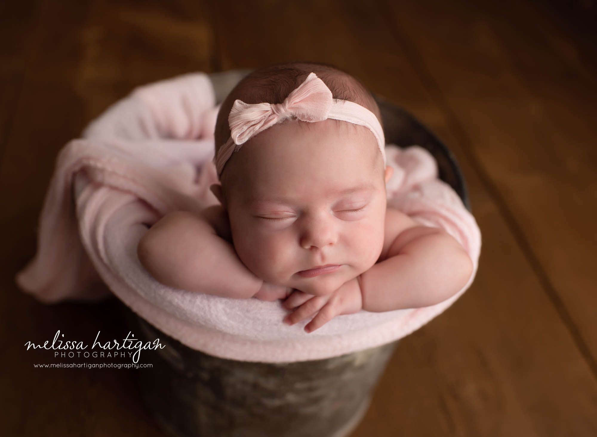 newborn baby girl posed in bucket newborn photography CT