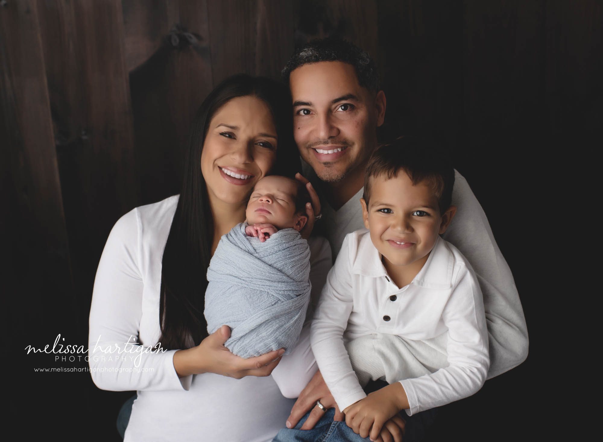 mom dad big brother and newborn baby boy family photo newborn photography session