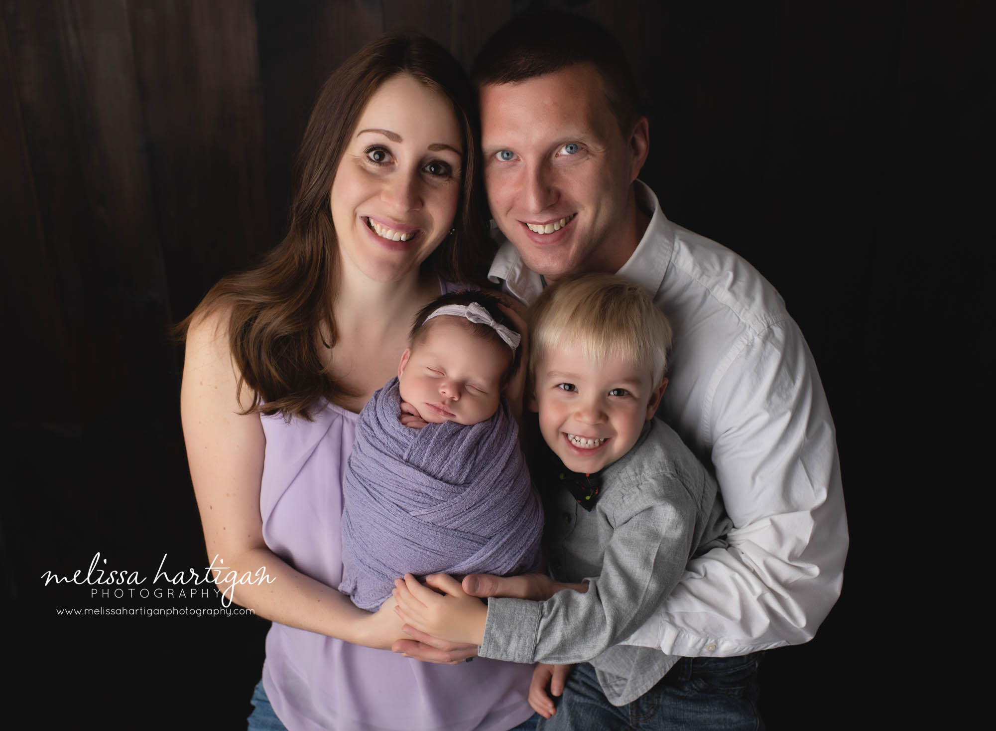 mom dad big brother and wrapped newborn girl family photos newborn photography CT