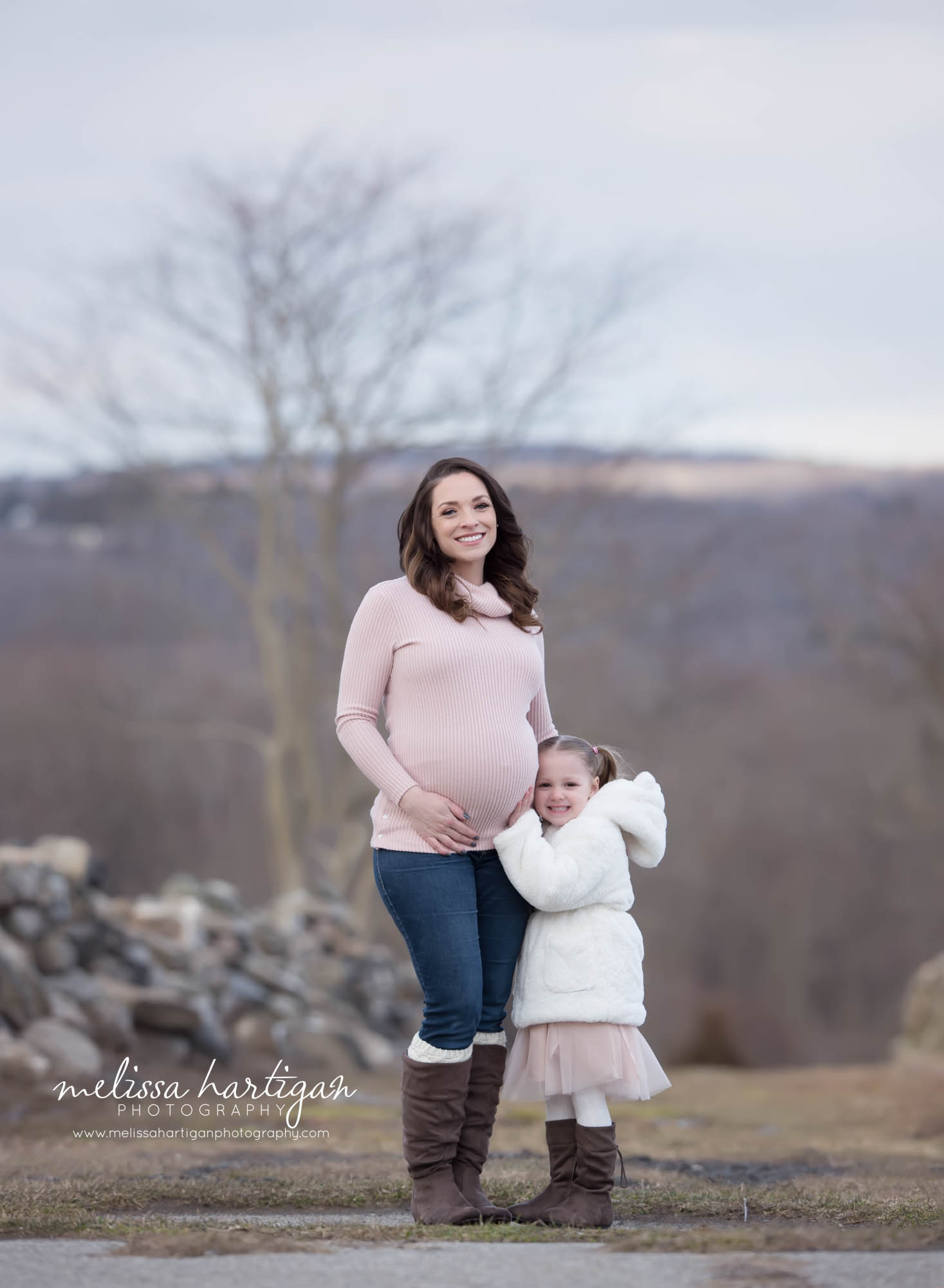 mom and big sister to be outside maternity photography