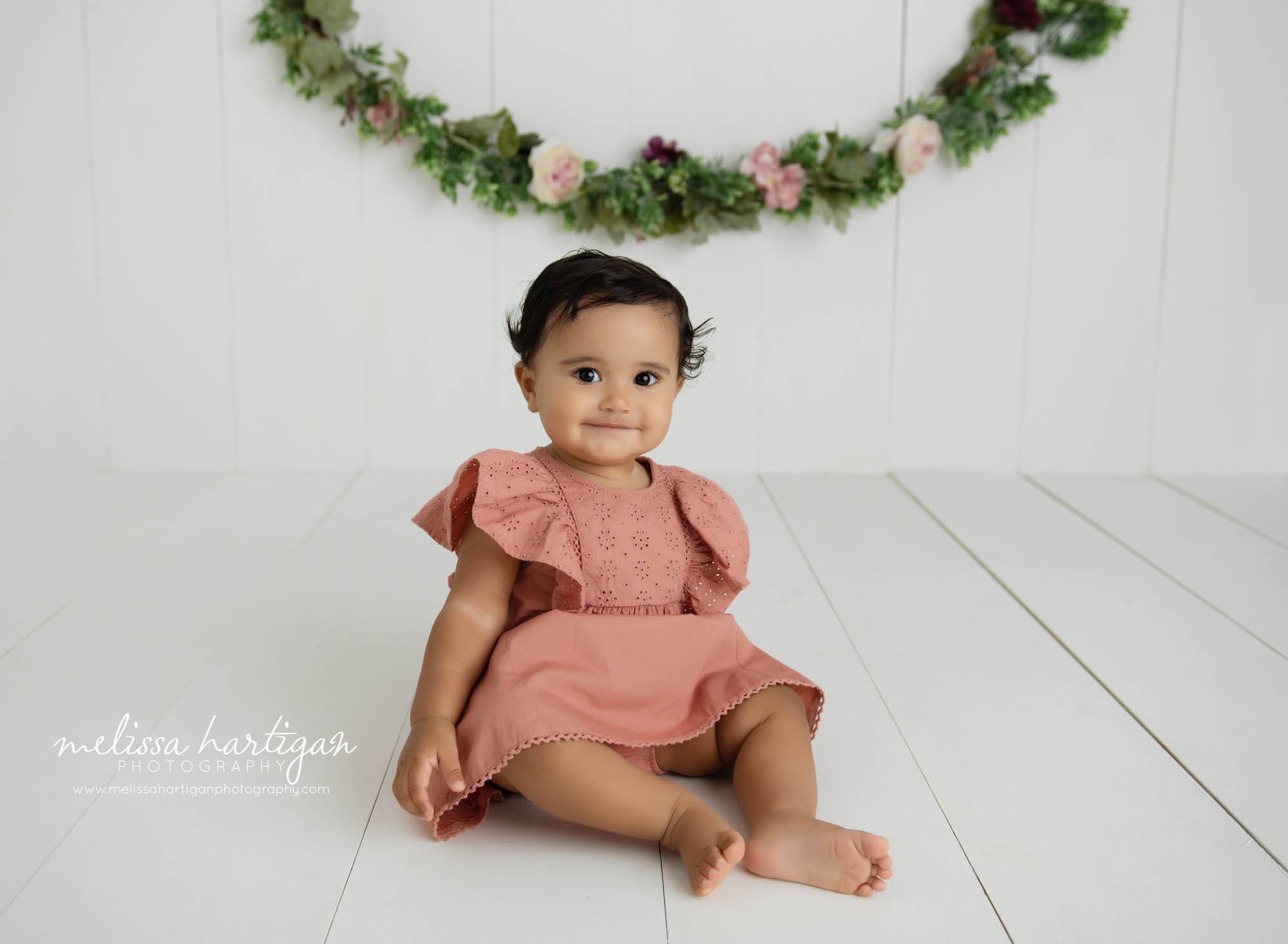 baby girl sitting on wood board backdrp studio milestone photography CT session