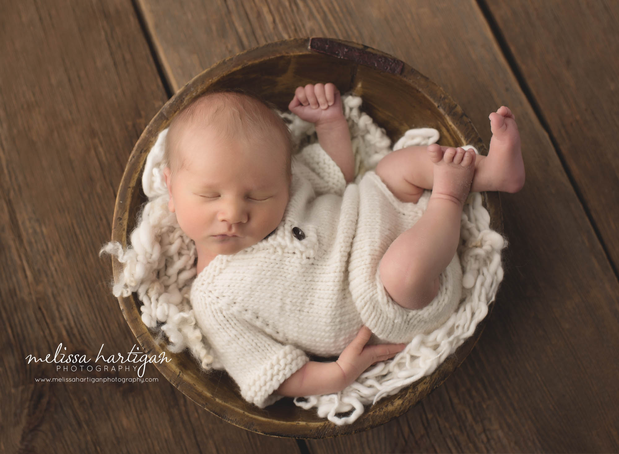 newborn baby boy wearing knitted outfit in wooden round bowl with cream layer fluff Connecticut Newborn Photographers
