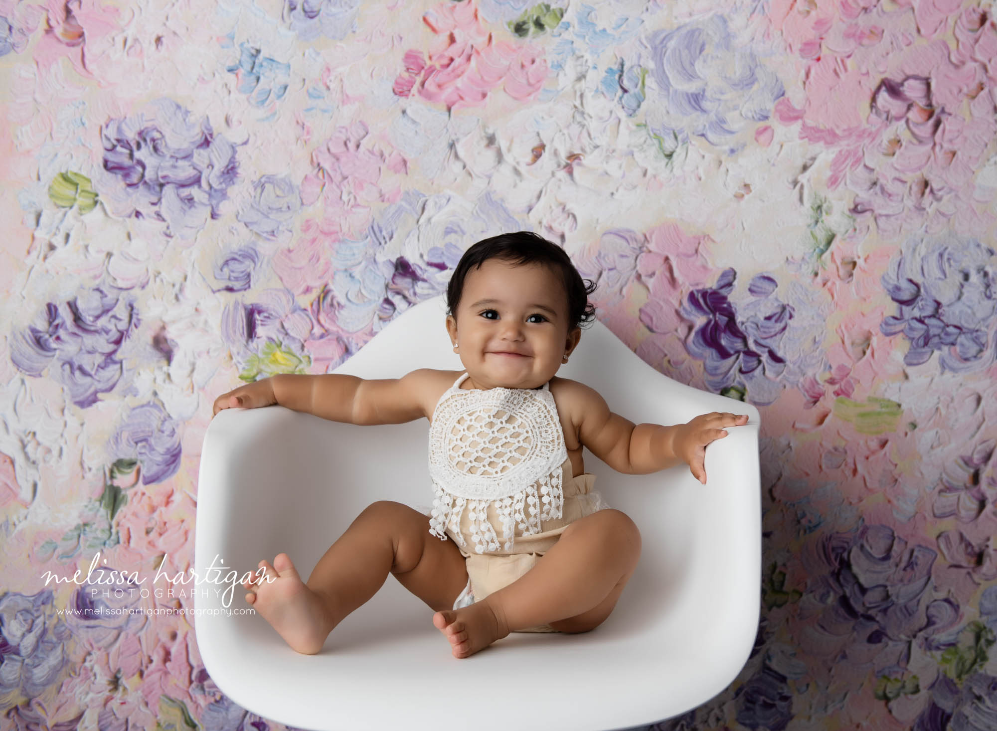 Baby girl sitting in white chair baby milestone photographer CT Middletown CT Baby Photography