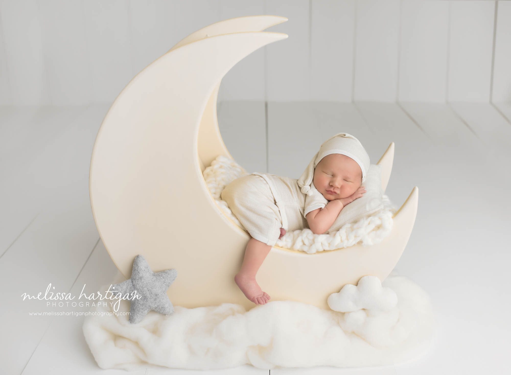 Newborn baby boy posed on wooden mood prop sleeping peacefully Newborn Photography CT New Milford CT Newborn Photography