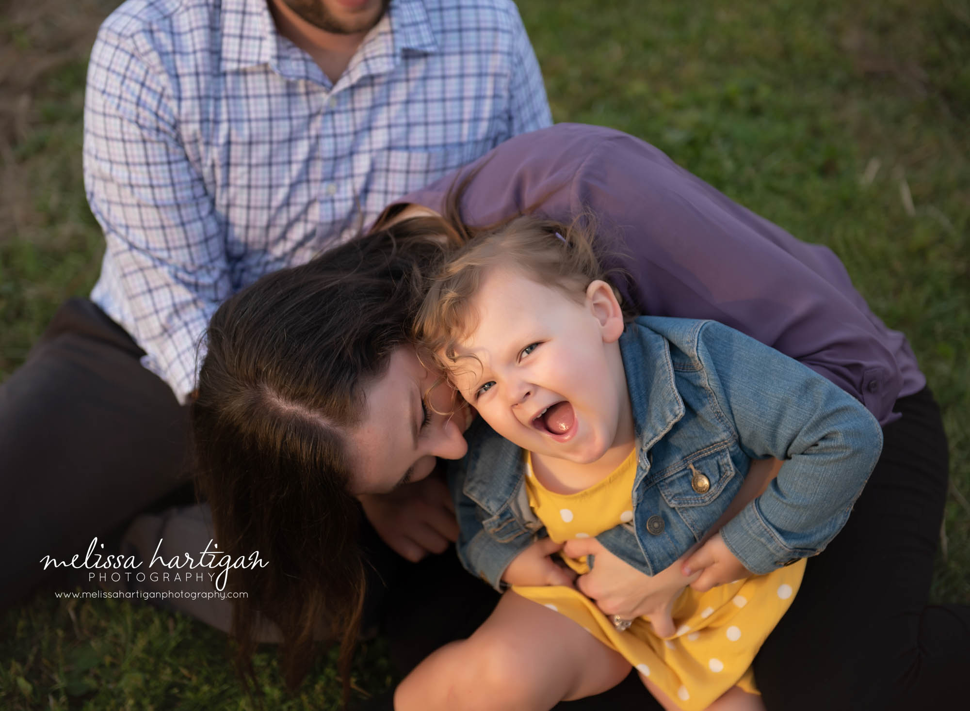 mom tickling daughter little girl laughing family photography pose
