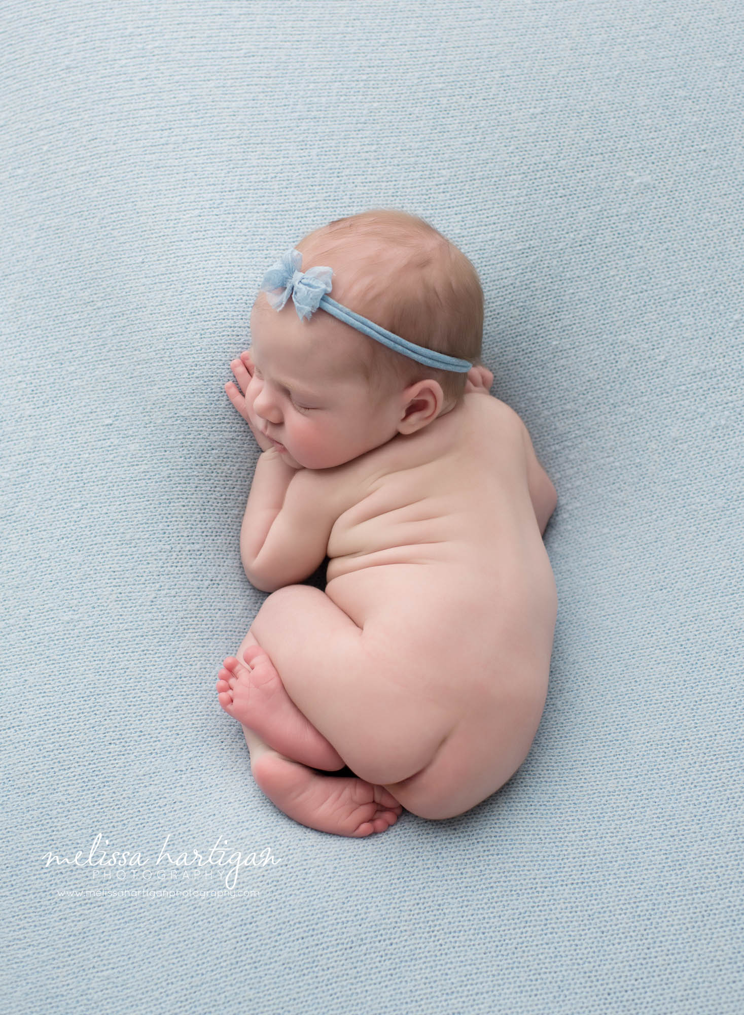 Newborn baby girl posed on tummy CT Newborn Photographers