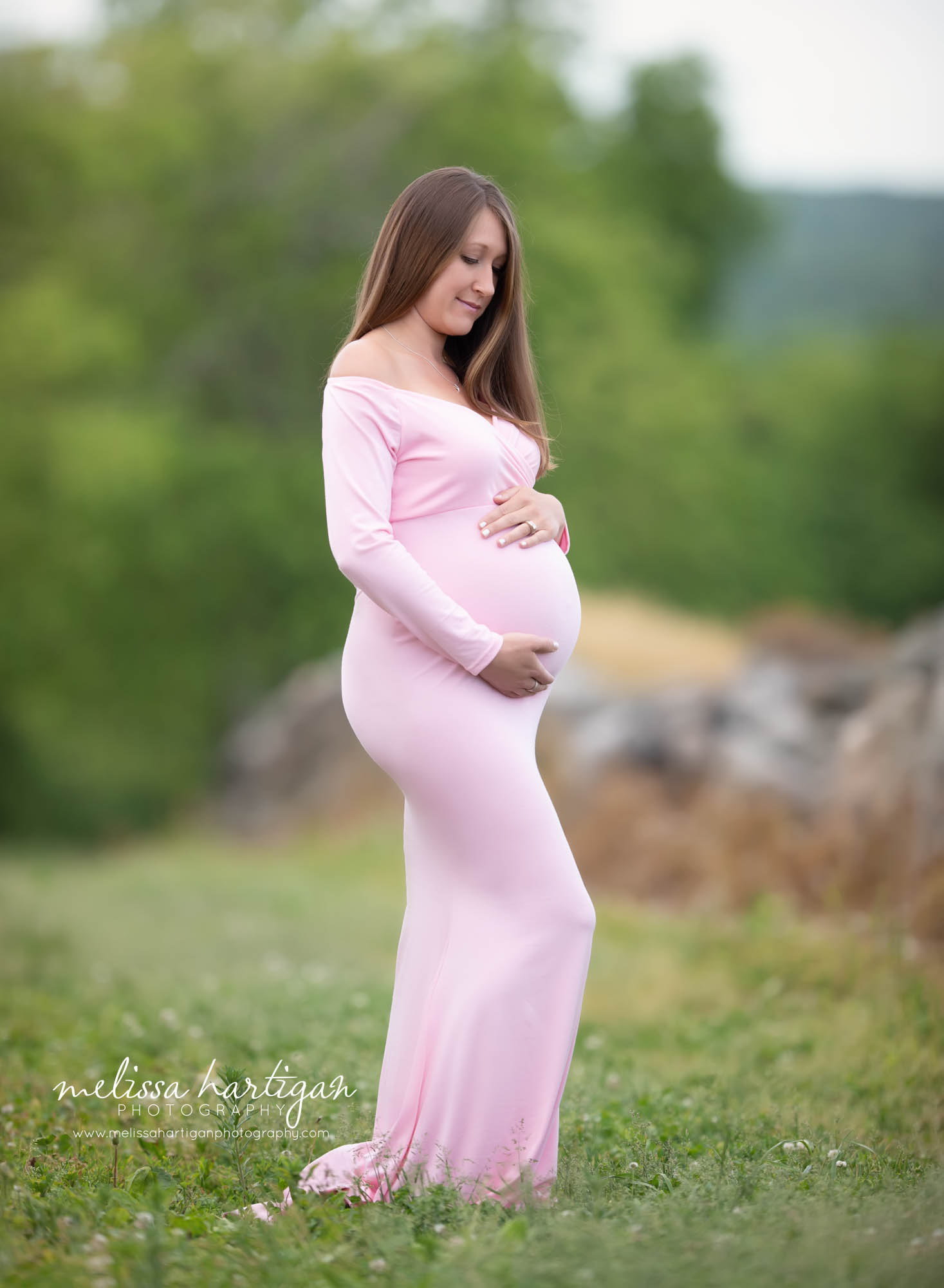 expectant mom to be holding baby bump CT maternity newborn photographer