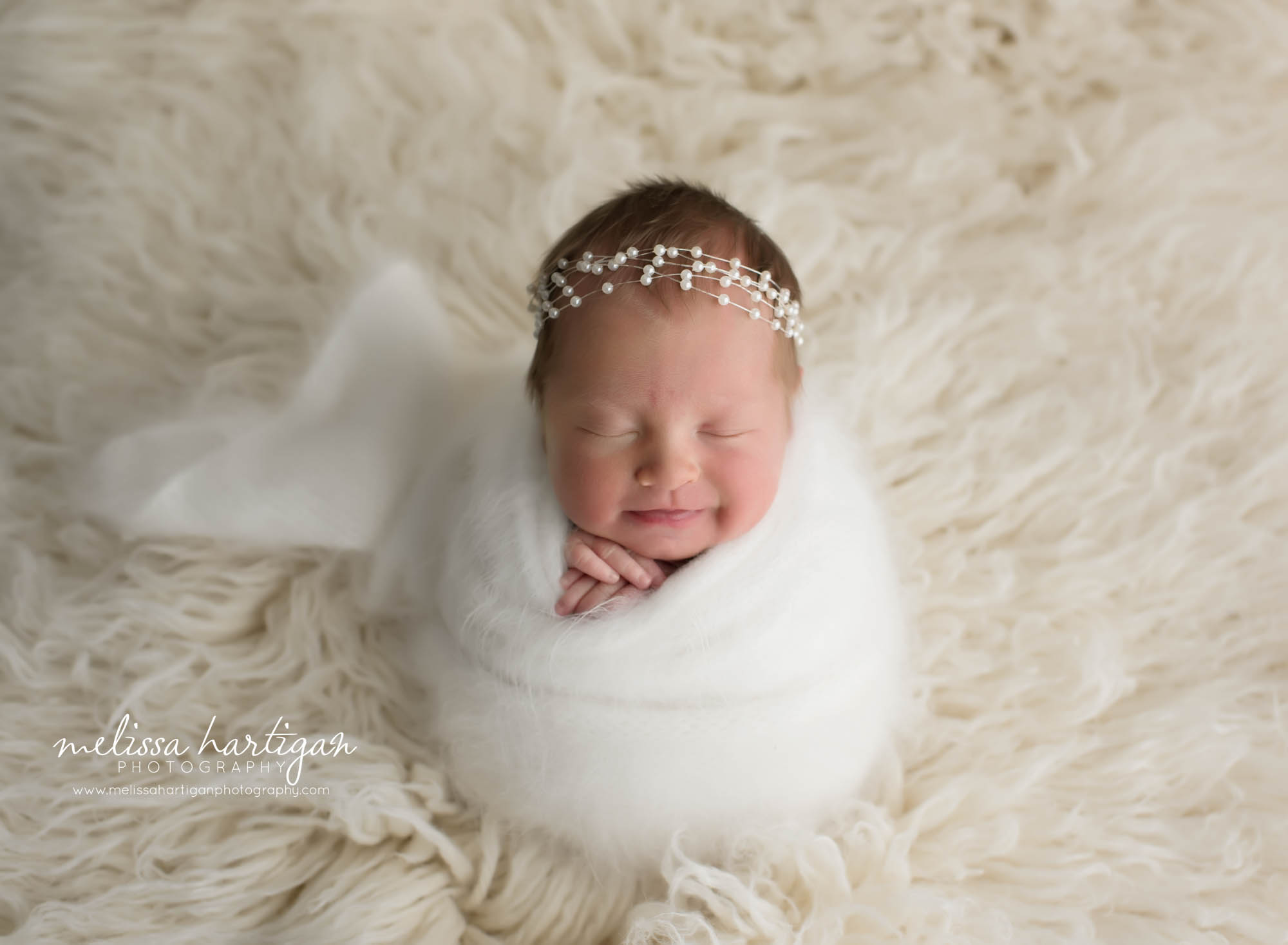 Newborn baby girl wrapped in white cream knitted wrap with bead headband CT maternity newborn photographer