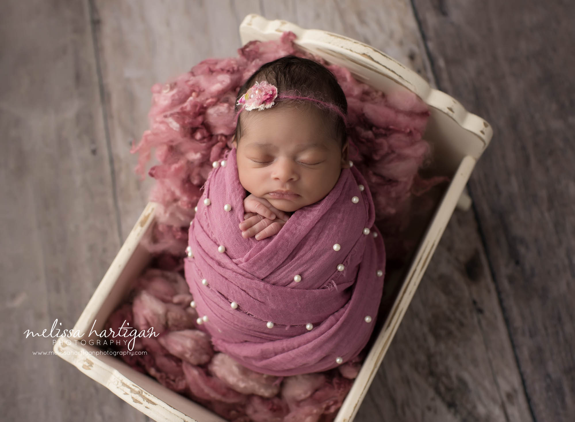 baby girl wrappe din pink wrap with pink headband and curly pink layer Newborn Photography CT