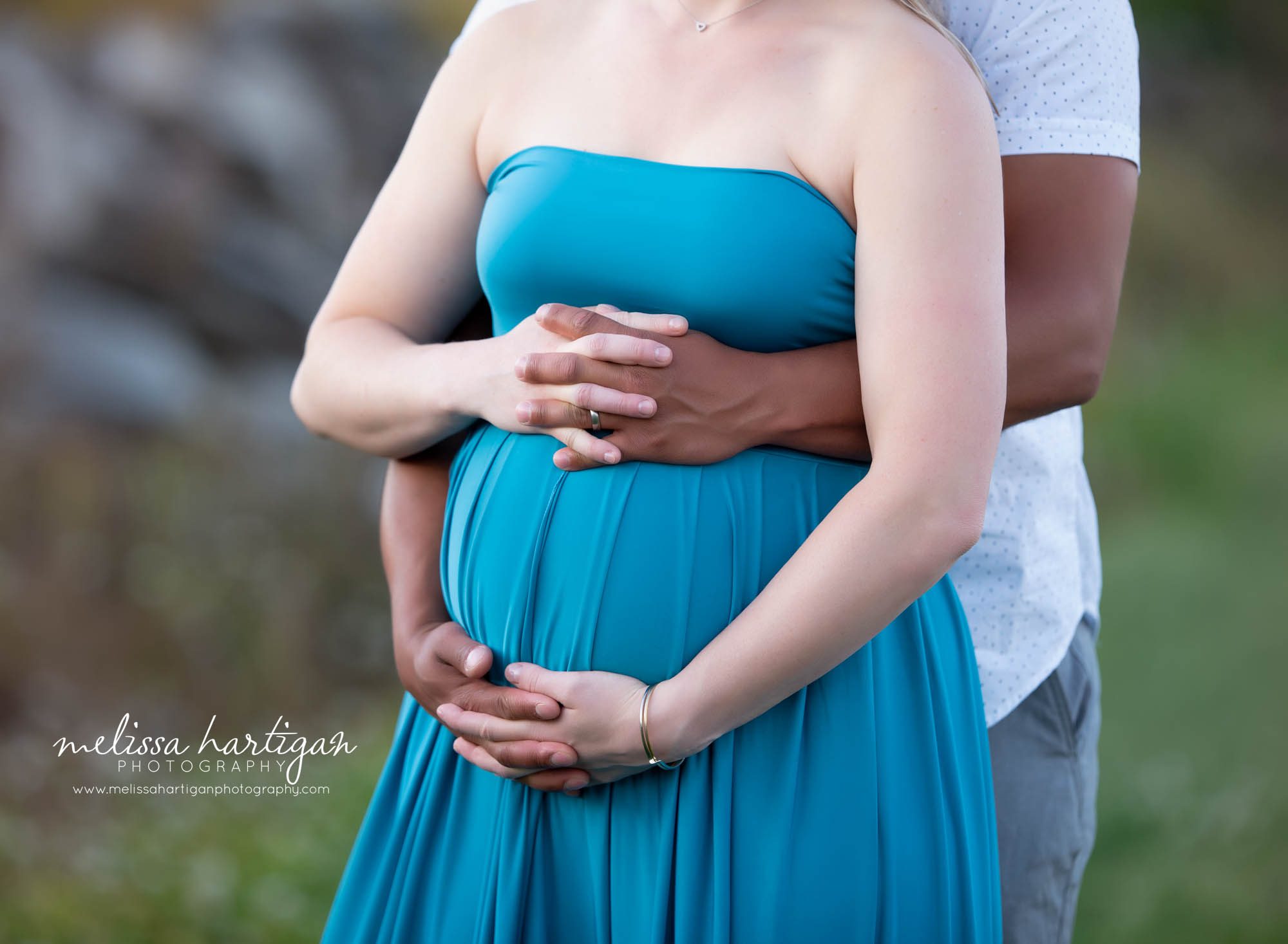 expectant couple close up of holding hand on pregnbany baby belly Manchester CT maternity Photography