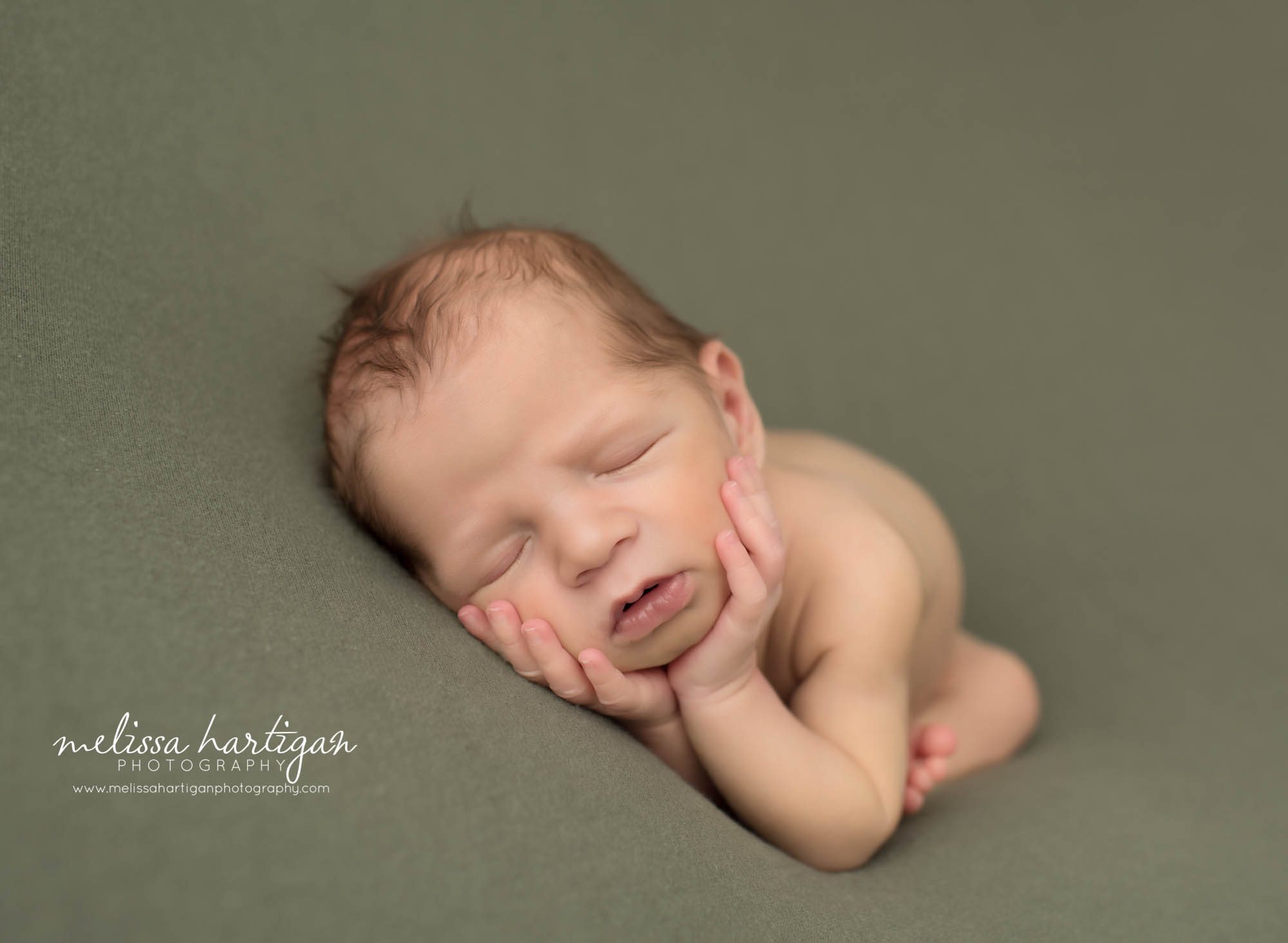 newborn baby posed on side with hands under chin Norwich CT Newborn Photographer