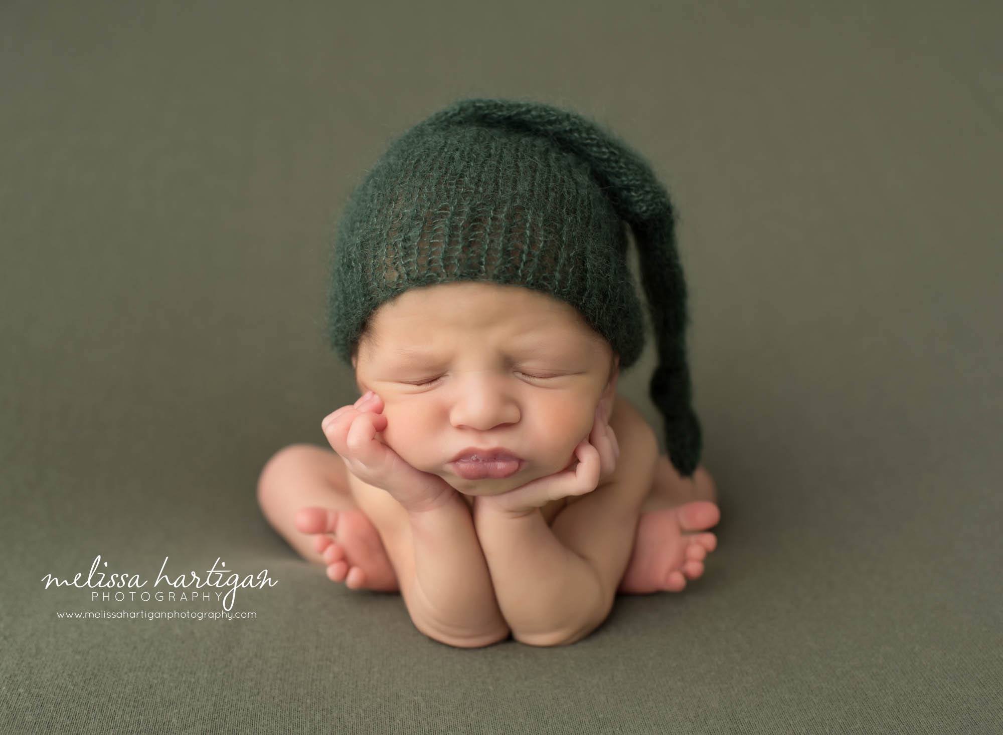Newborn baby boy posed like froggy in CT newborn photography studio session