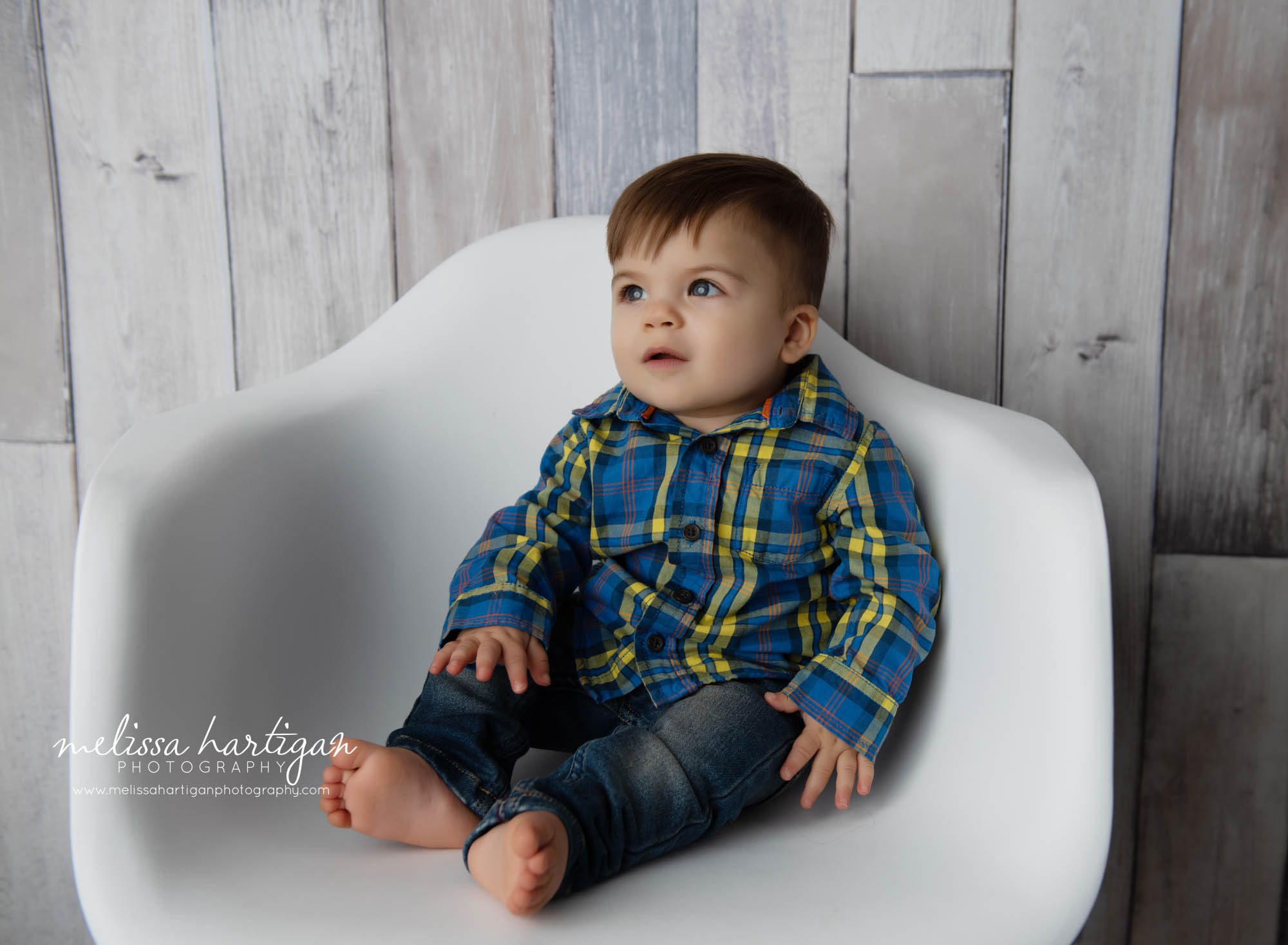 baby boy sitting on chair looking away CT baby photography