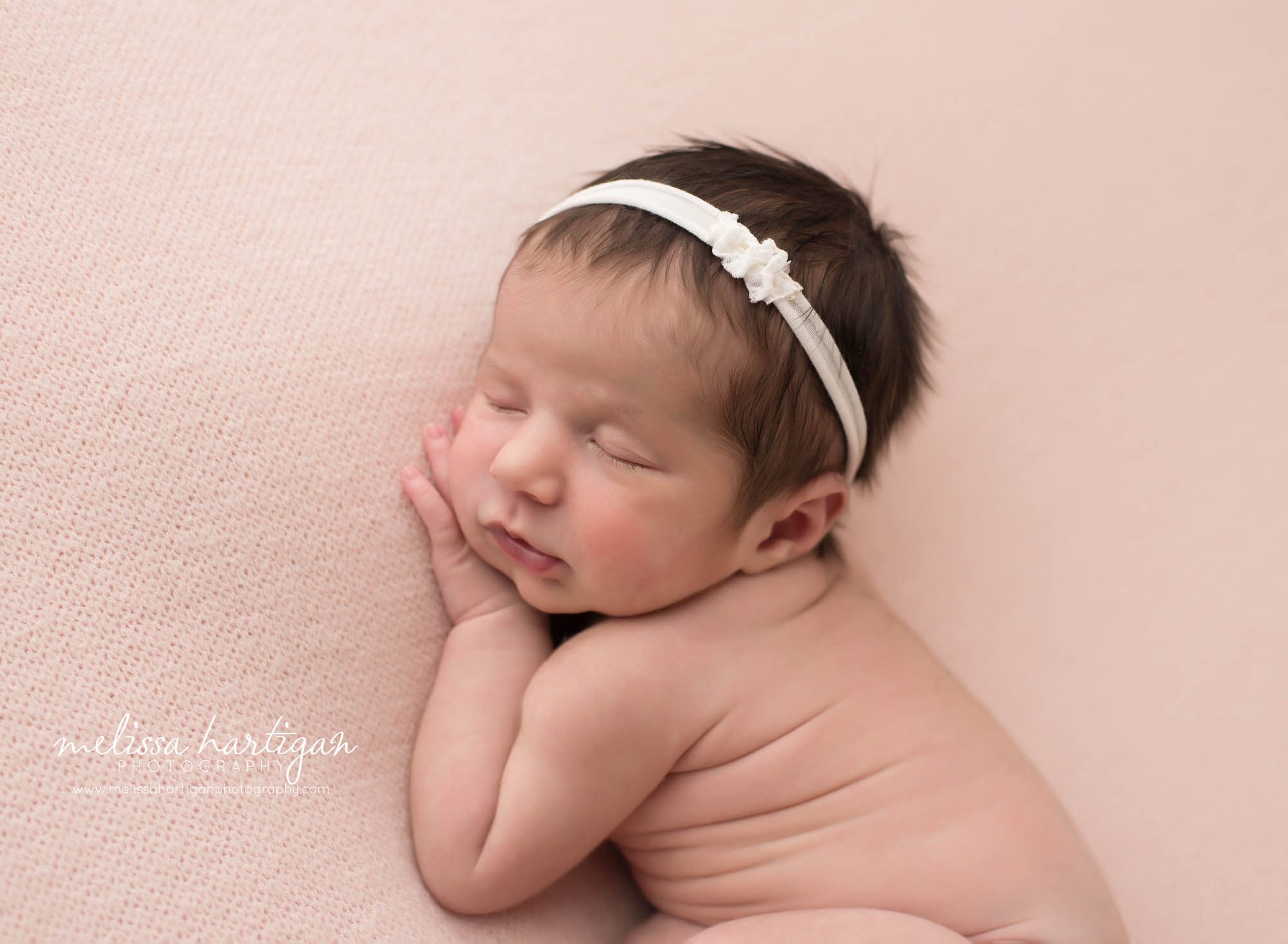 baby girl posed on side with cream headband CT maternity Newborn Photography