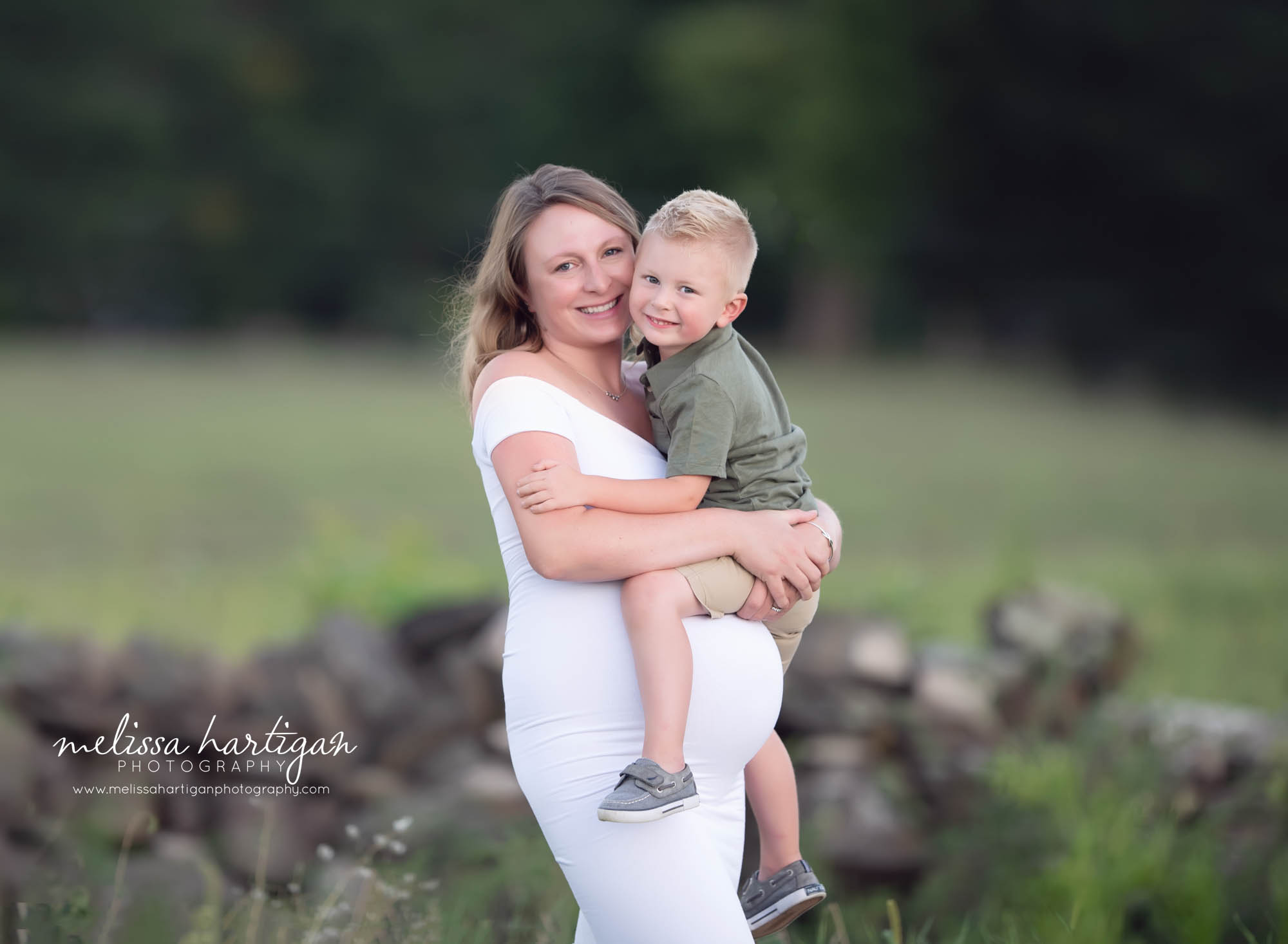 mom holding toddler son in mommy and me maternity family picture CT maternity photography