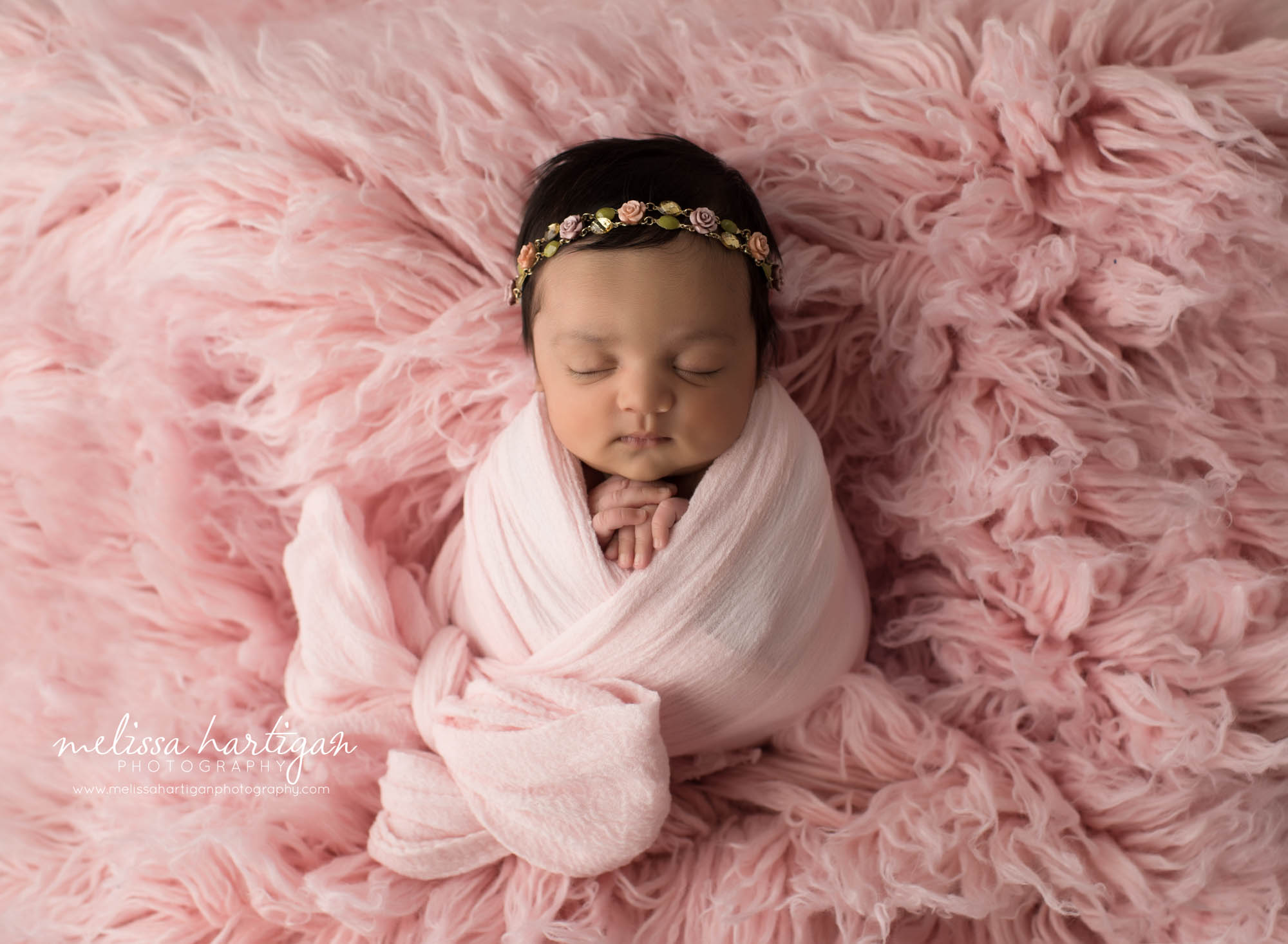 newborn baby girl wrapped in pink wrap with bow CT newborn photographer