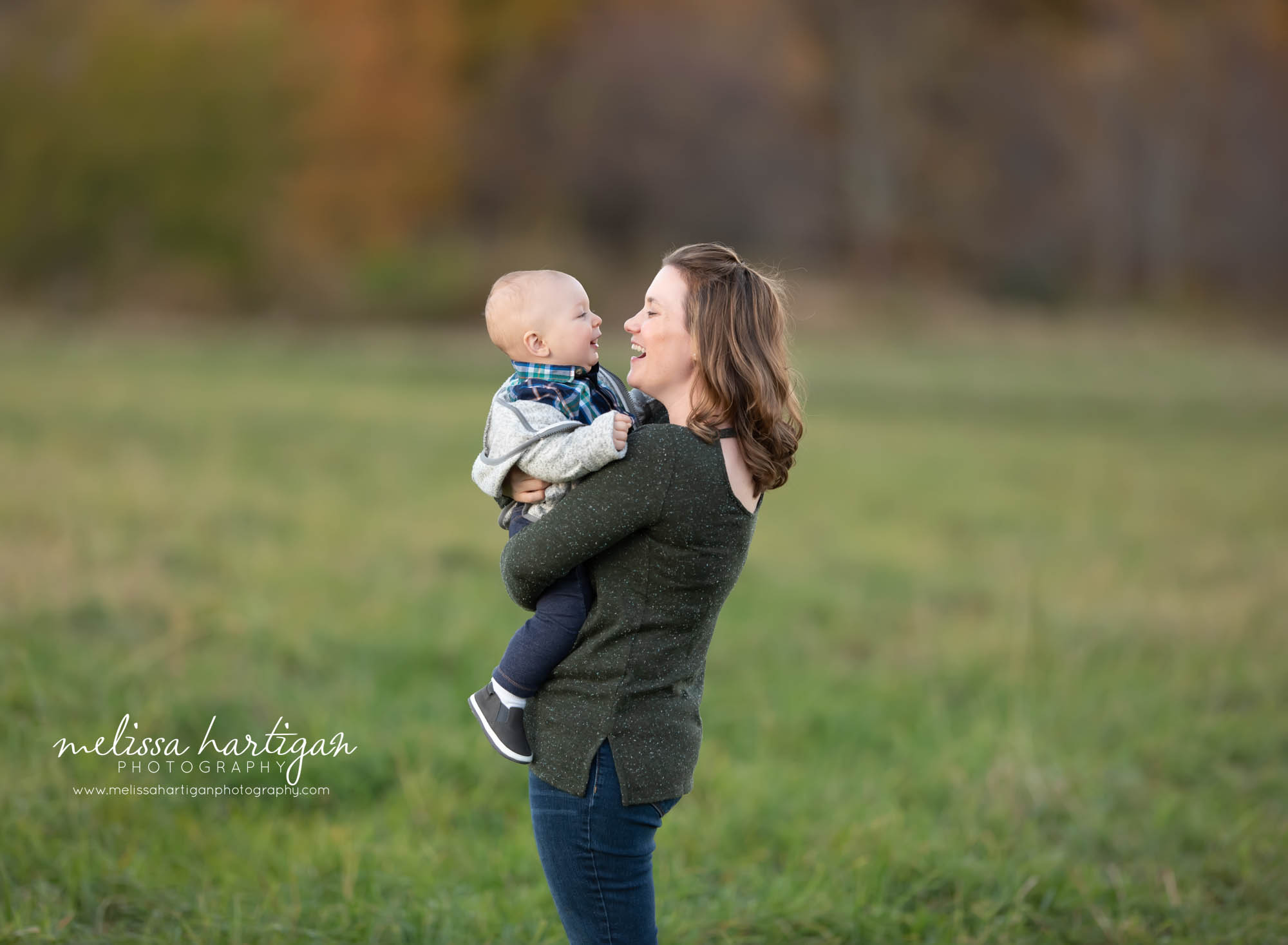 mom holding baby son laughing CT family Photography