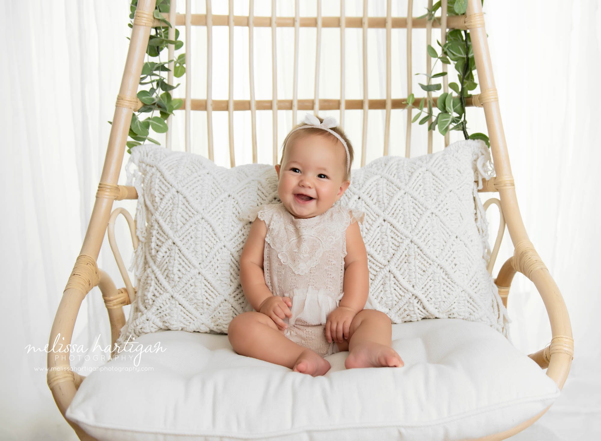 baby girl smiling laughing on chair