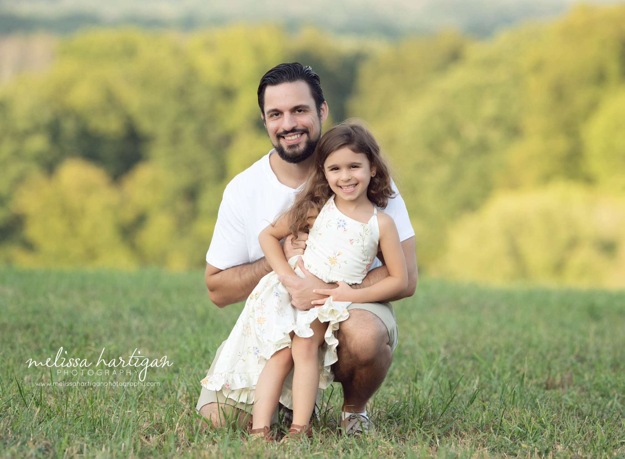 Dad with older daughter outside family photography
