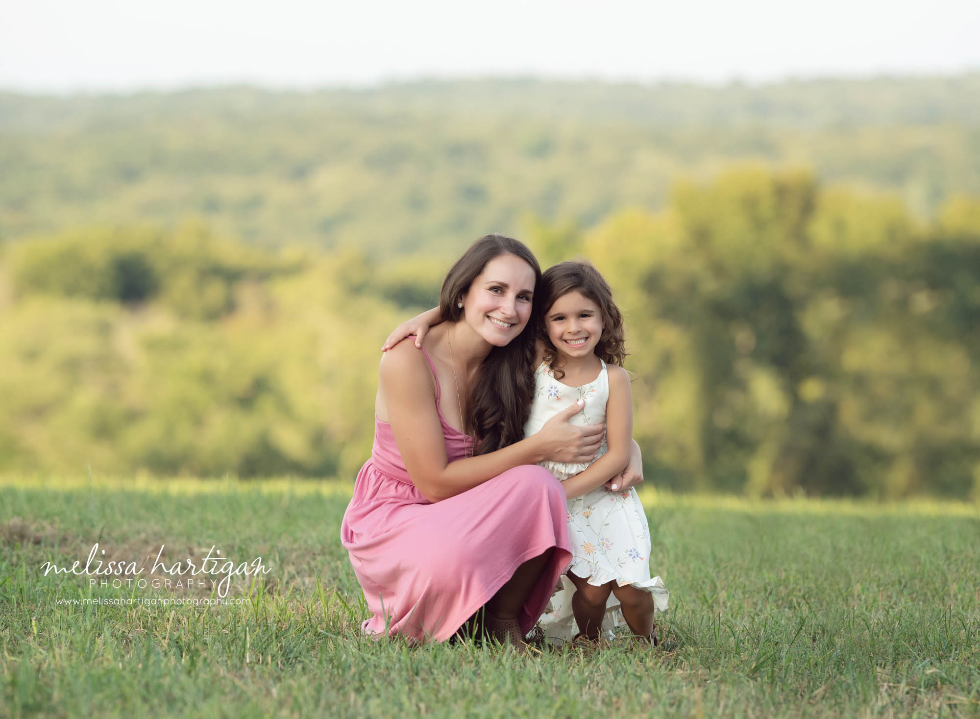 mom with older daughter outside family photography