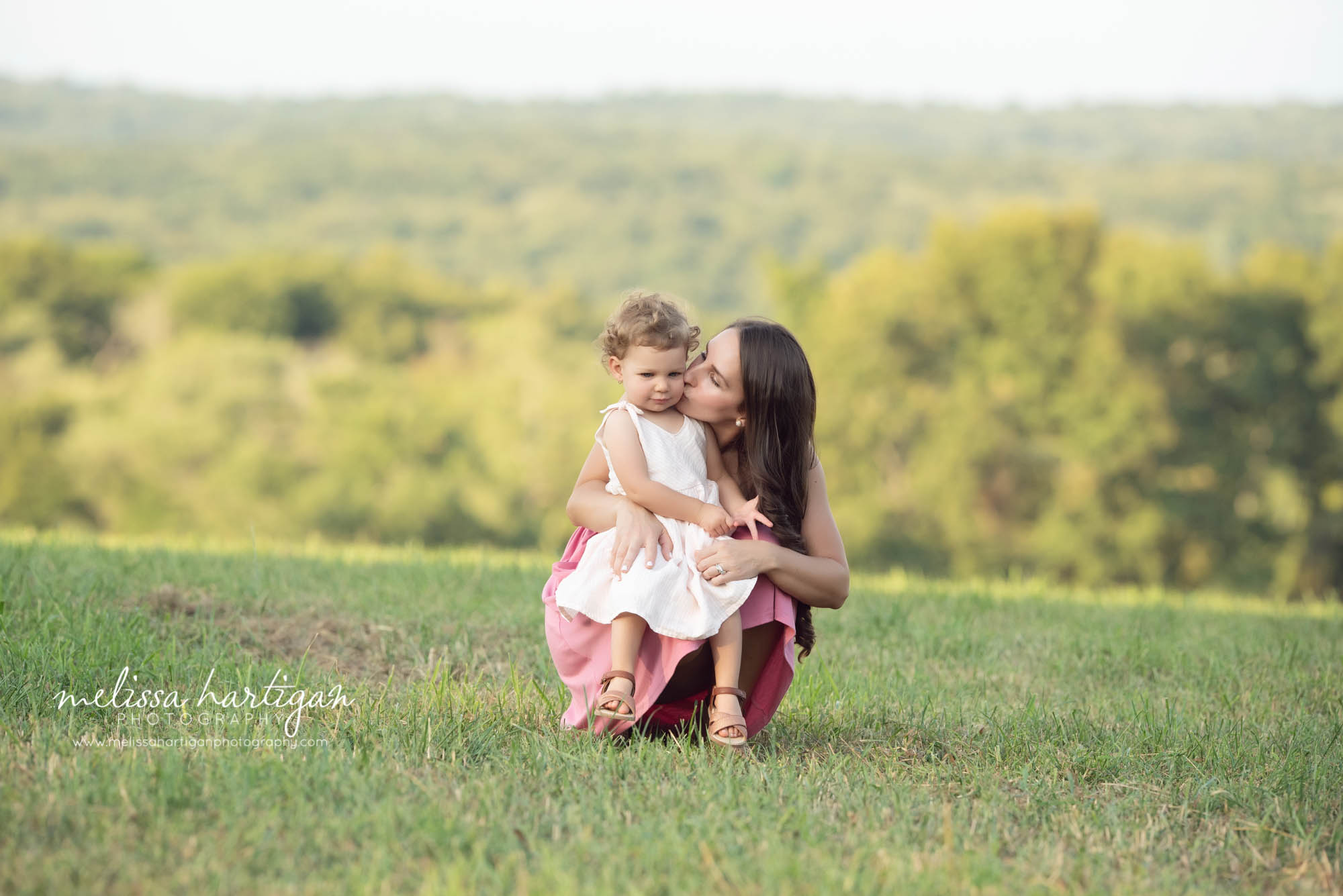 mom kissing toddler daughter on cheek family photography west hartford ct