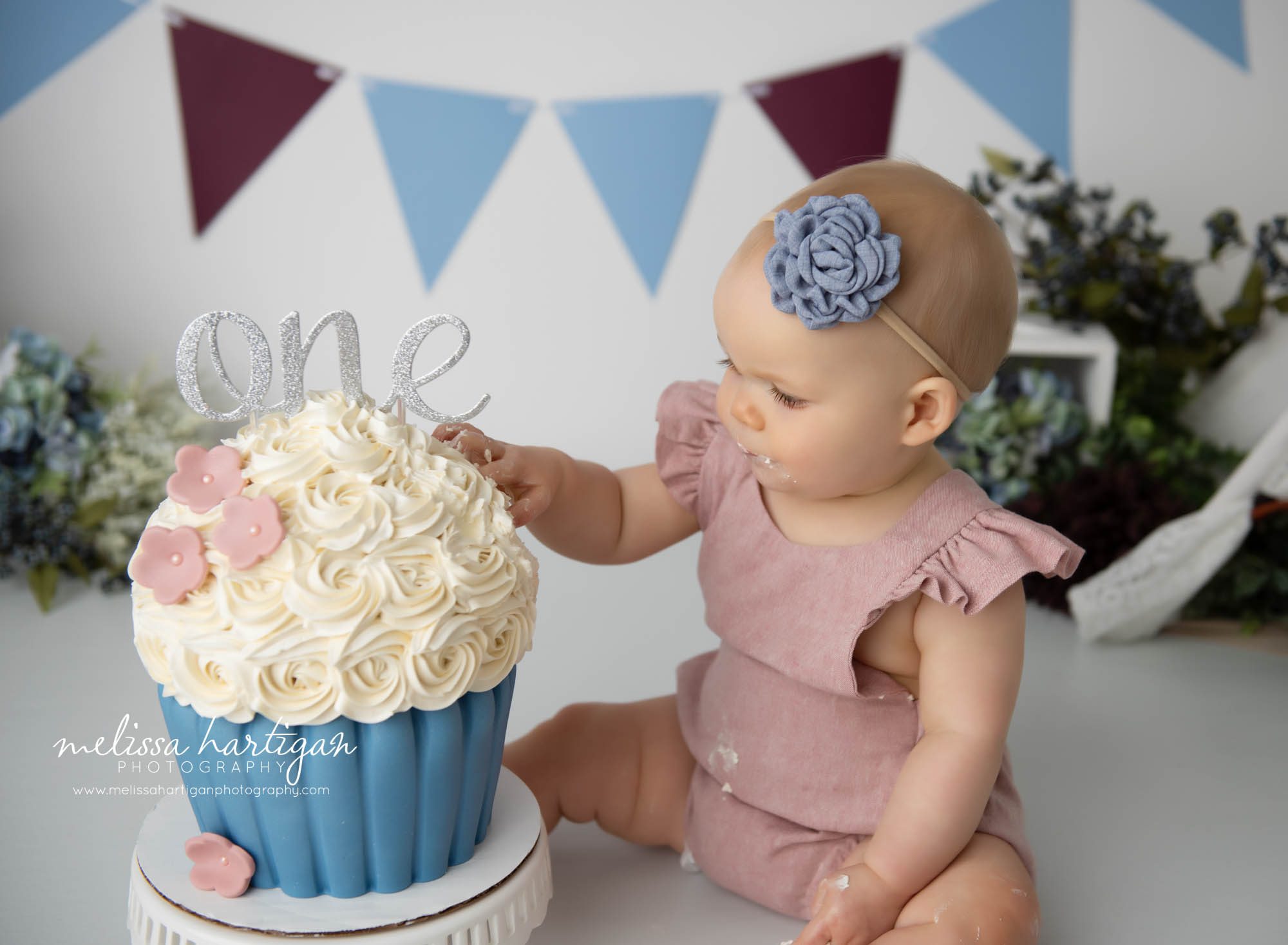 baby girl sitting with her cake smash cake ct baby photographer