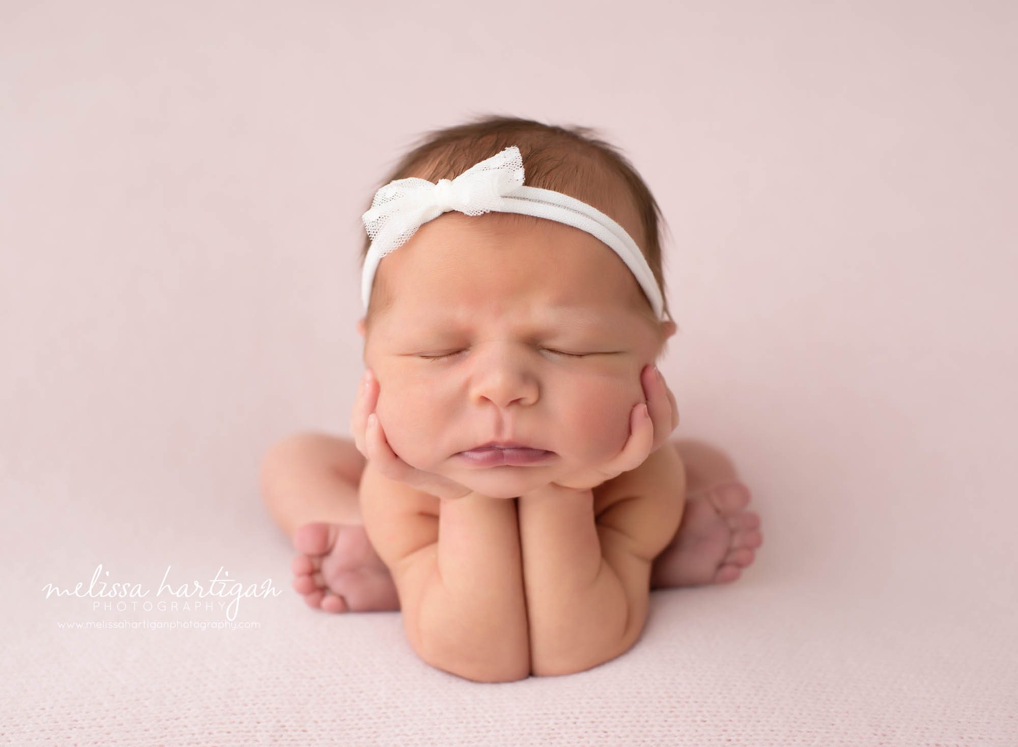 newborn baby girl posed froggy pose