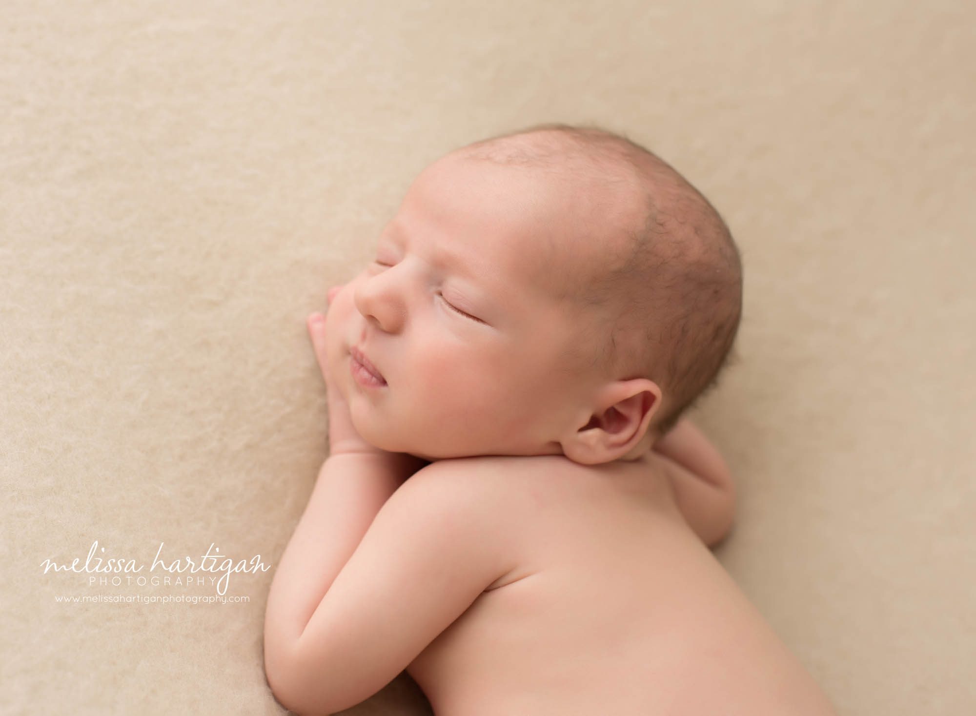 newborn baby boy posed on side with side profile CT newborn Photographer