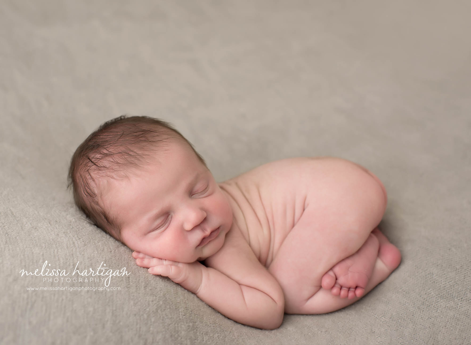 Newborn baby boy posed on tummy newborn photography pose Massachusetts newborn photographer