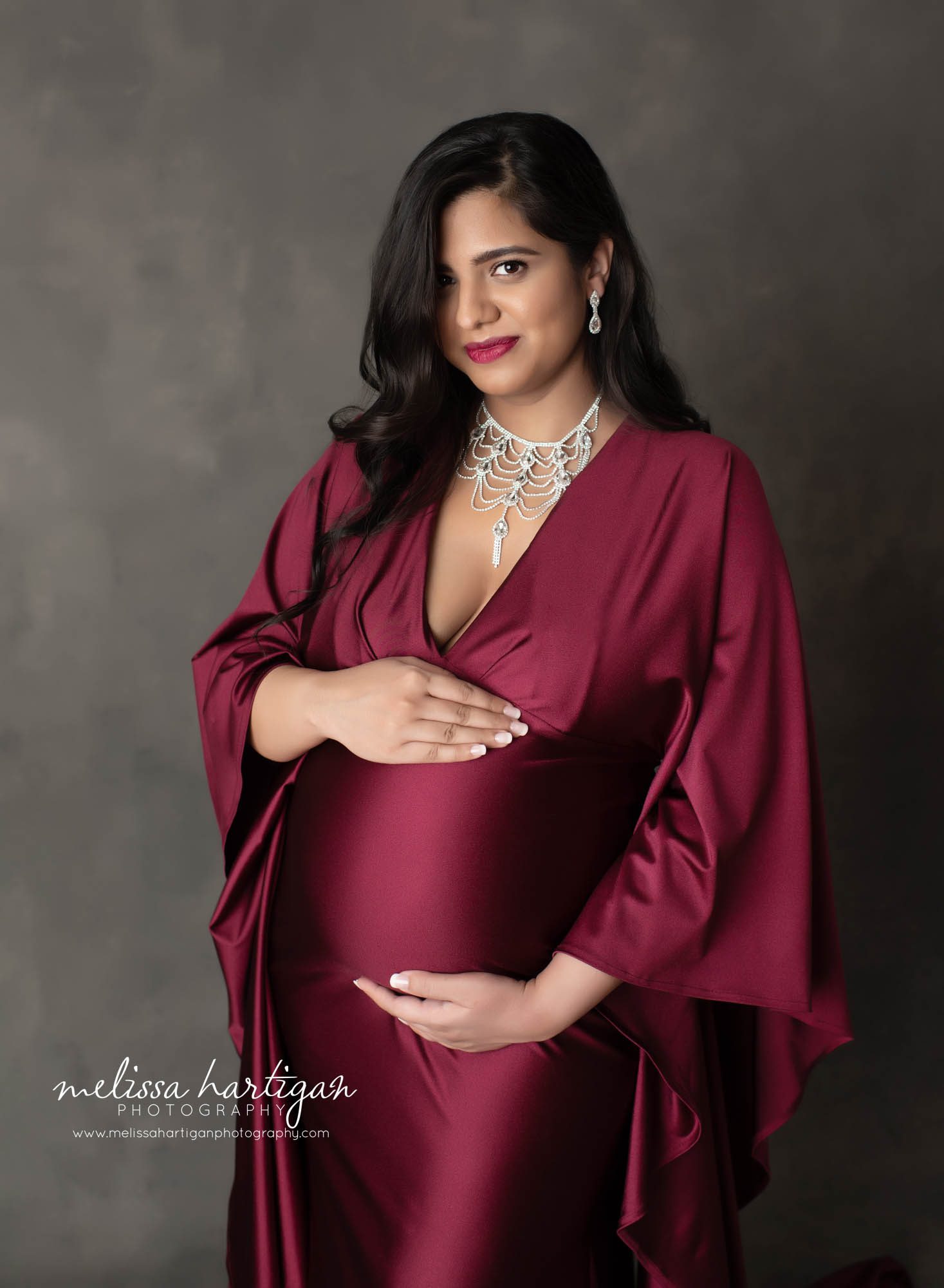 pregnant mom holding baby bump studio maternity photography CT