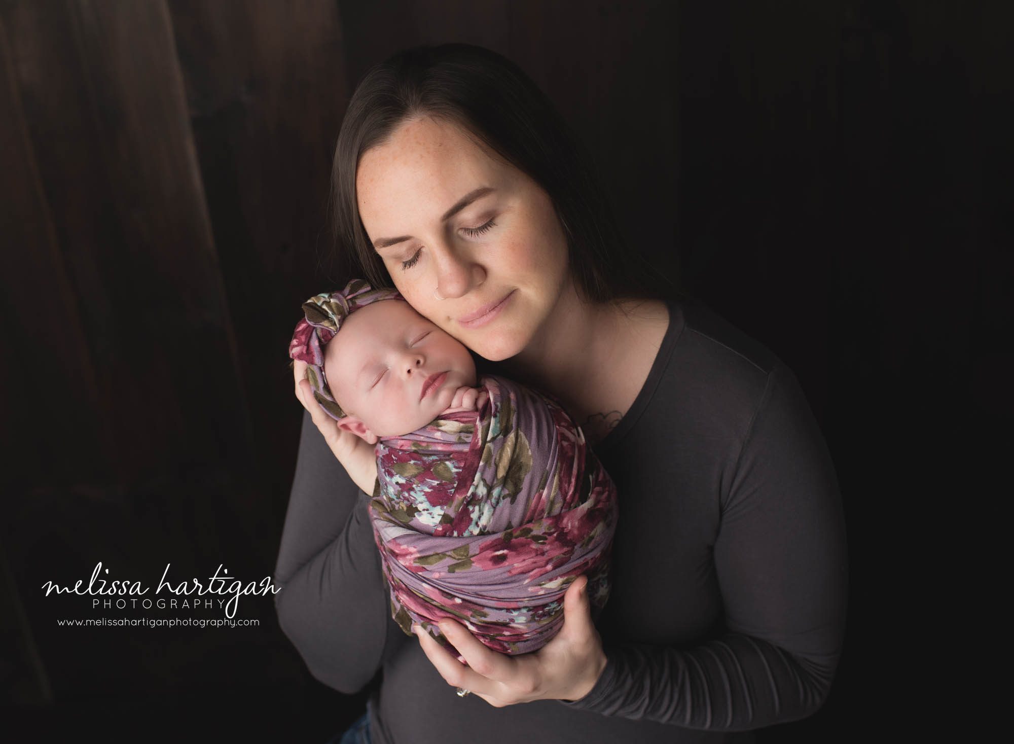mom holding baby daughter cheek to cheek CT newborn Photography