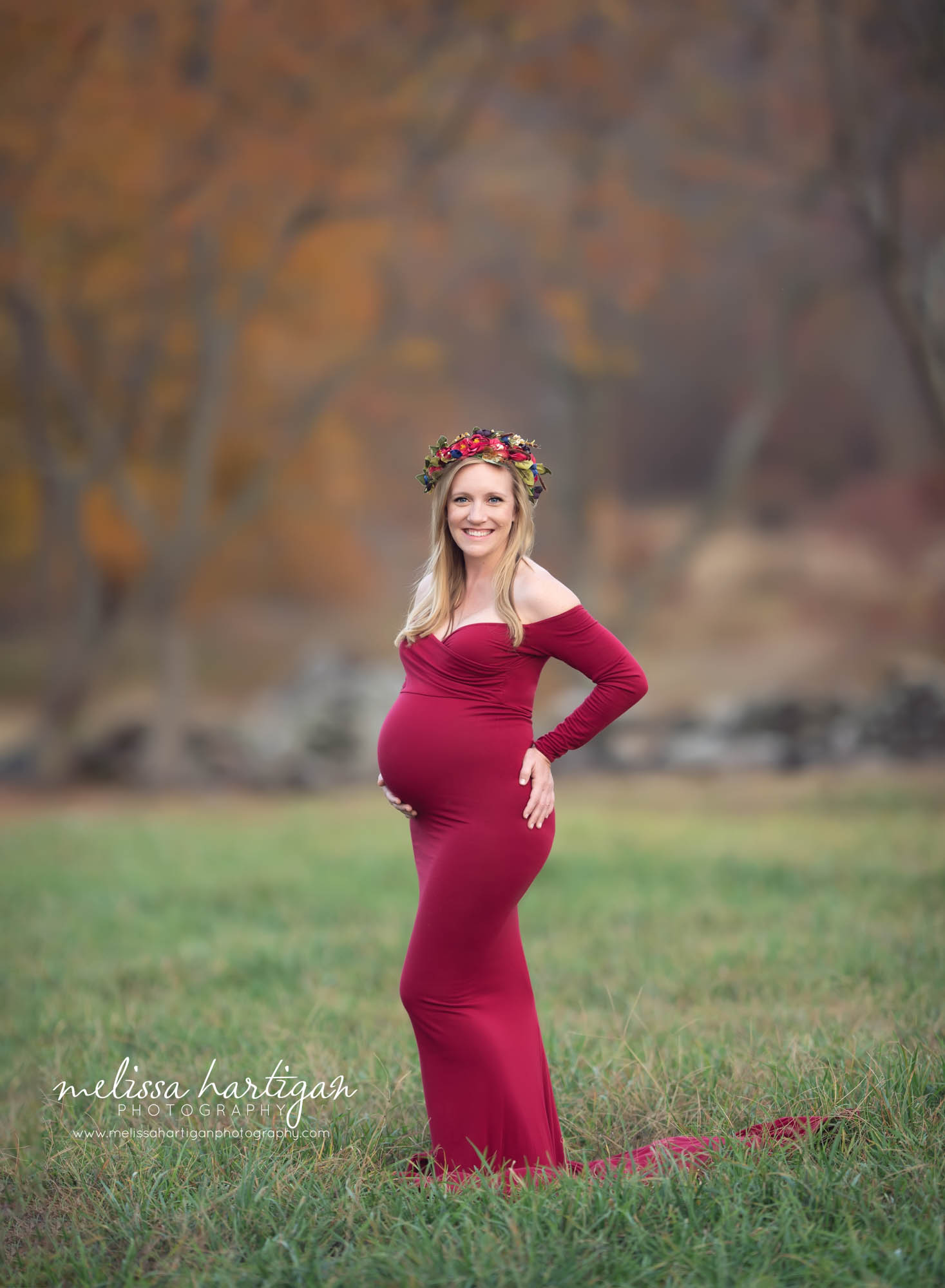 mom holding baby bump standing maternity pose outdoor fall maternity pictures CT maternity newborn photographer