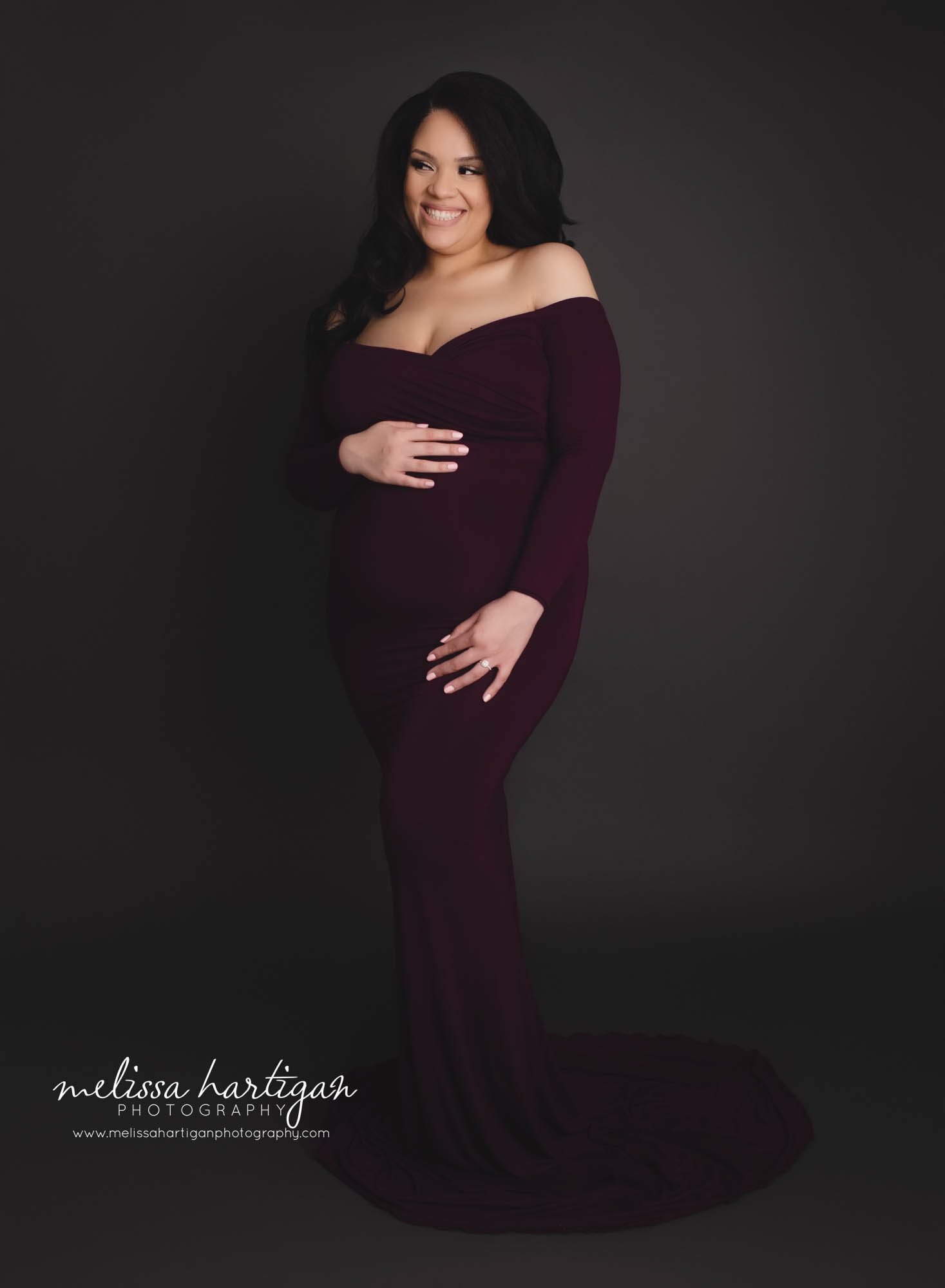 mom smiling holding baby bump melissa hartigan photography maternity photographer hartford county CT