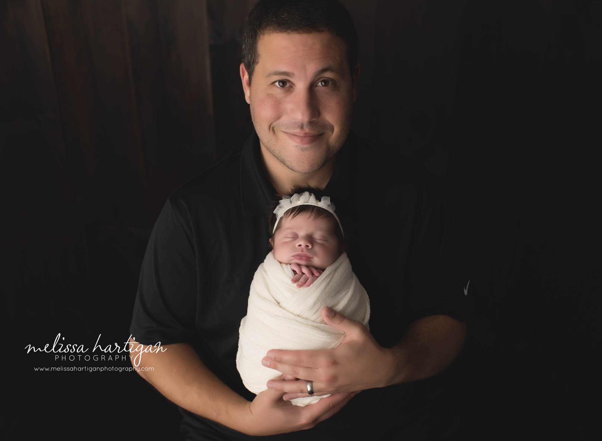 dad holding newborn daughter parent pose newborn photography CT session