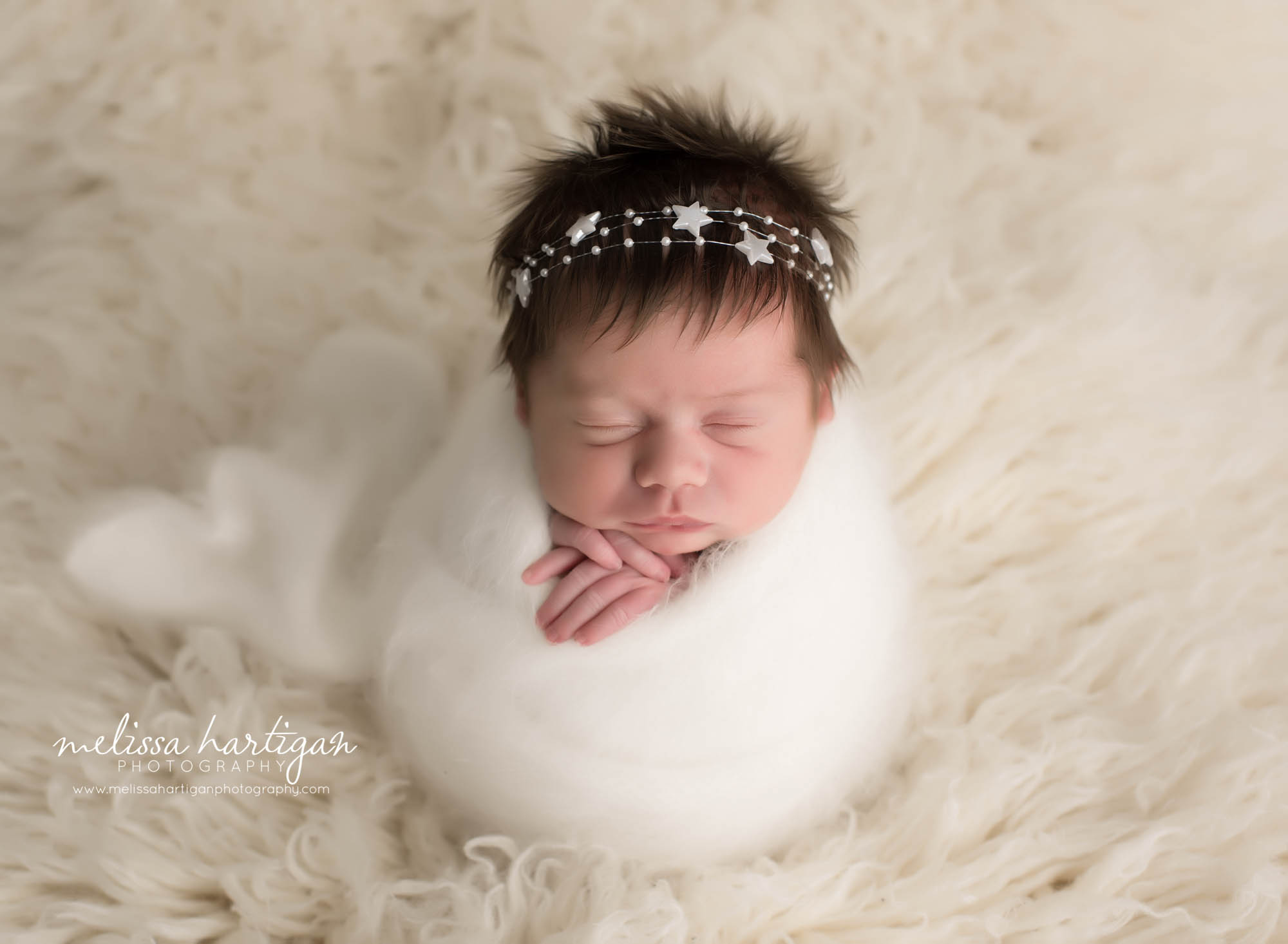 newborn abby girl wrapped in knitted newborn wrap with star headband CT newborn photographer
