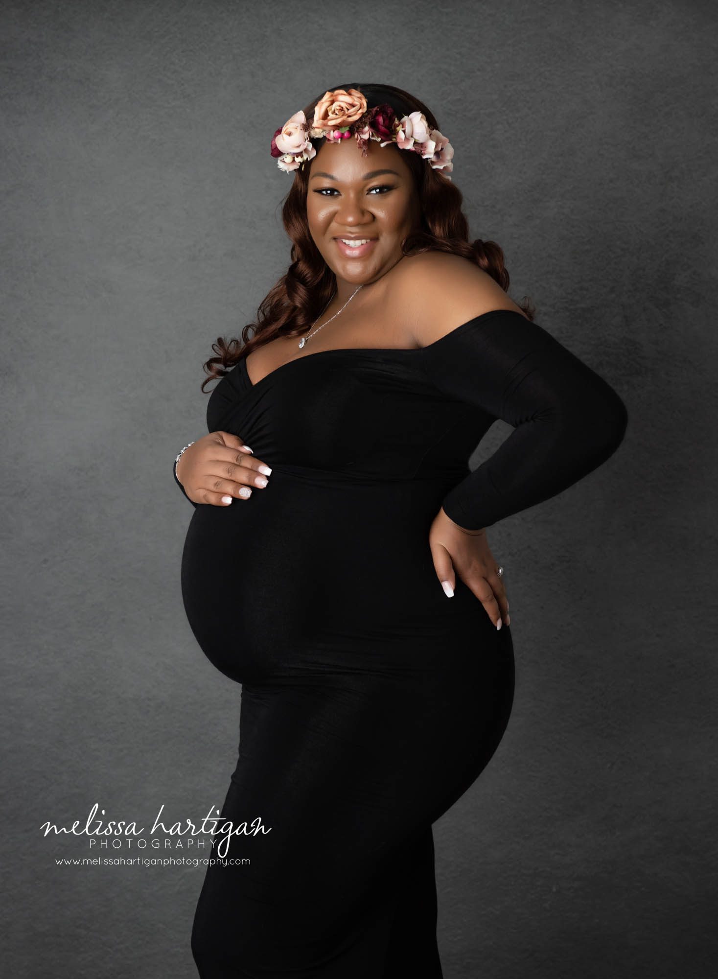 pregnant mom wearing long form fitted maternity gown with sleeves CT maternity photography MA