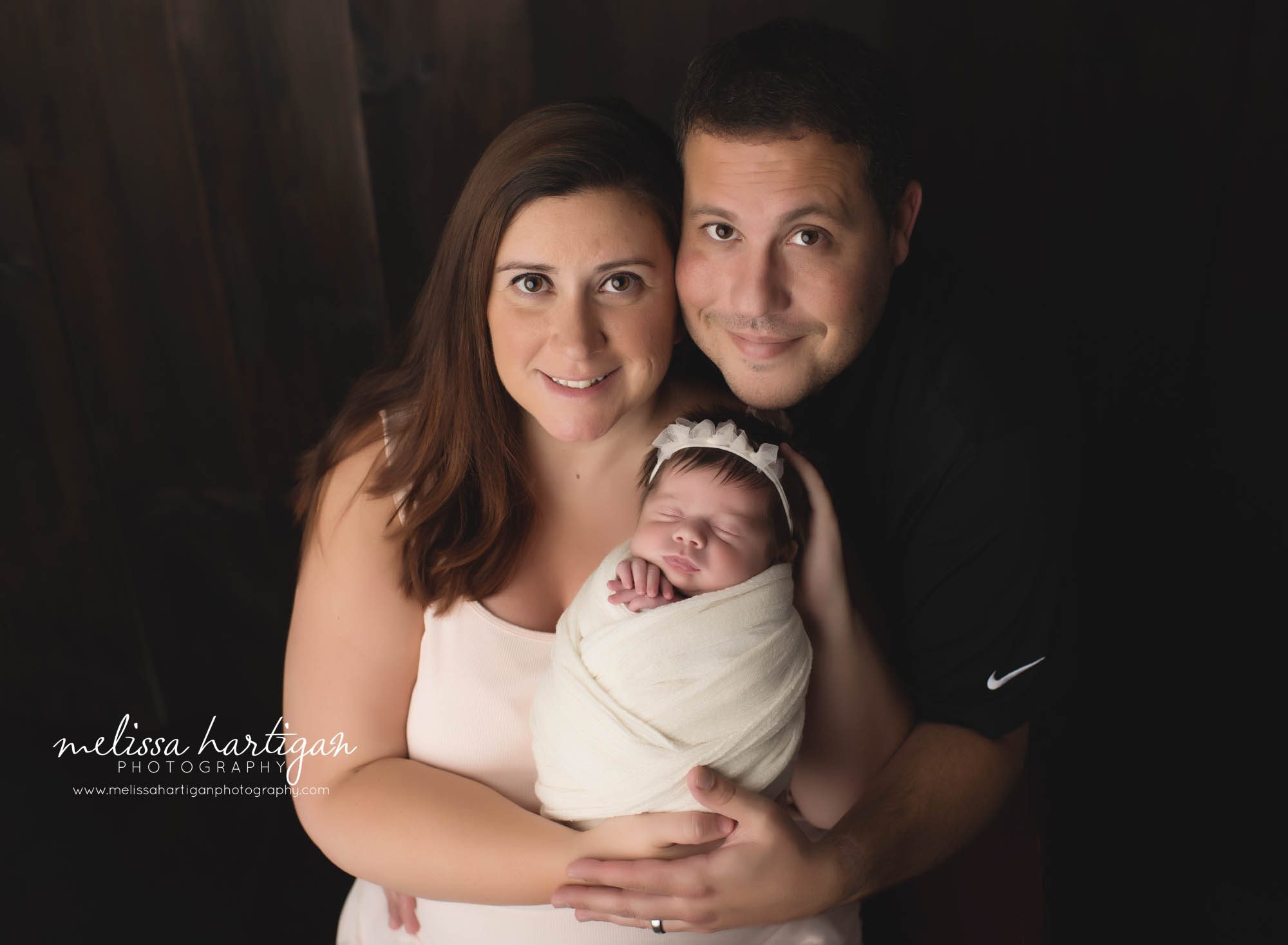 mom dad and newborn daughter family photo connecticut newborn photographer