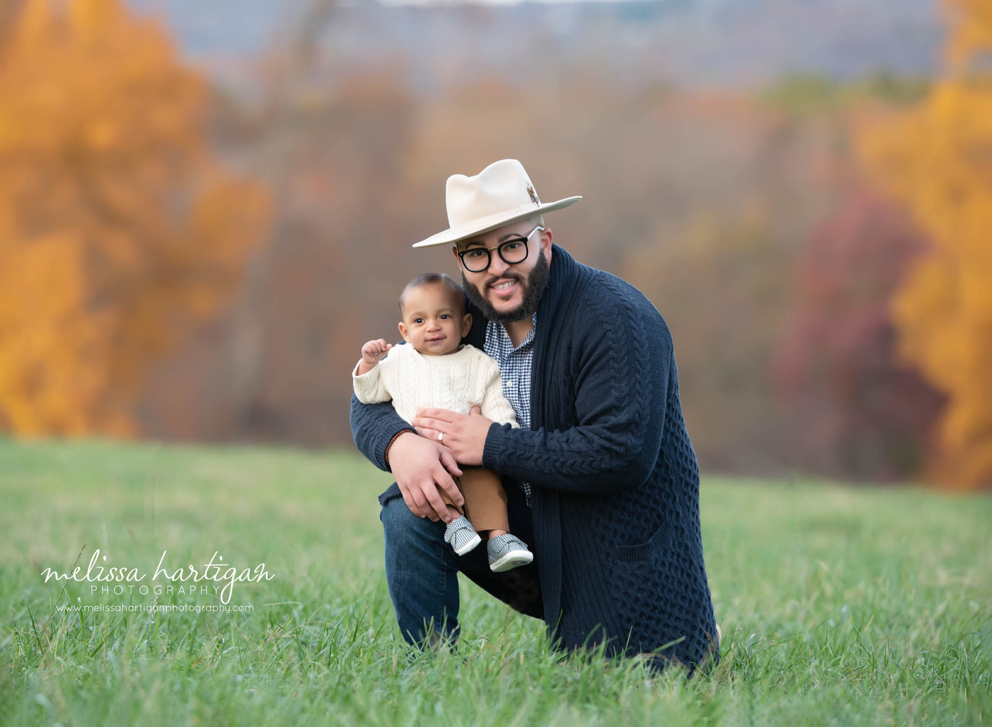 dad holding baby son outdoor family session CT photography