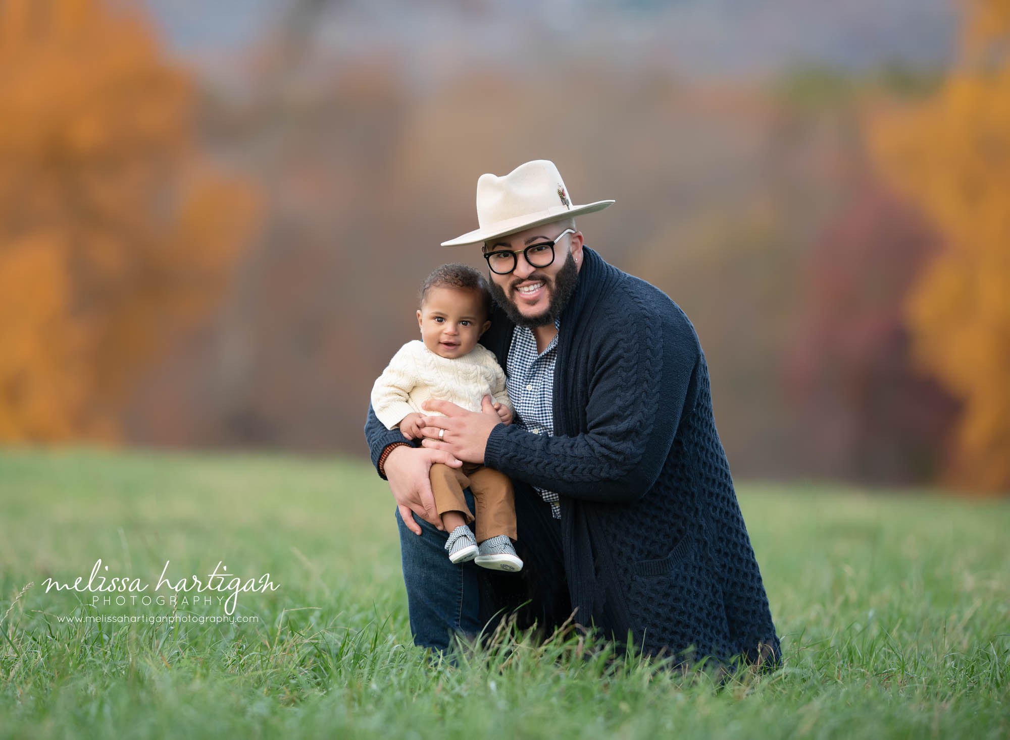 dad holding baby son outside family session CT park family photography CT