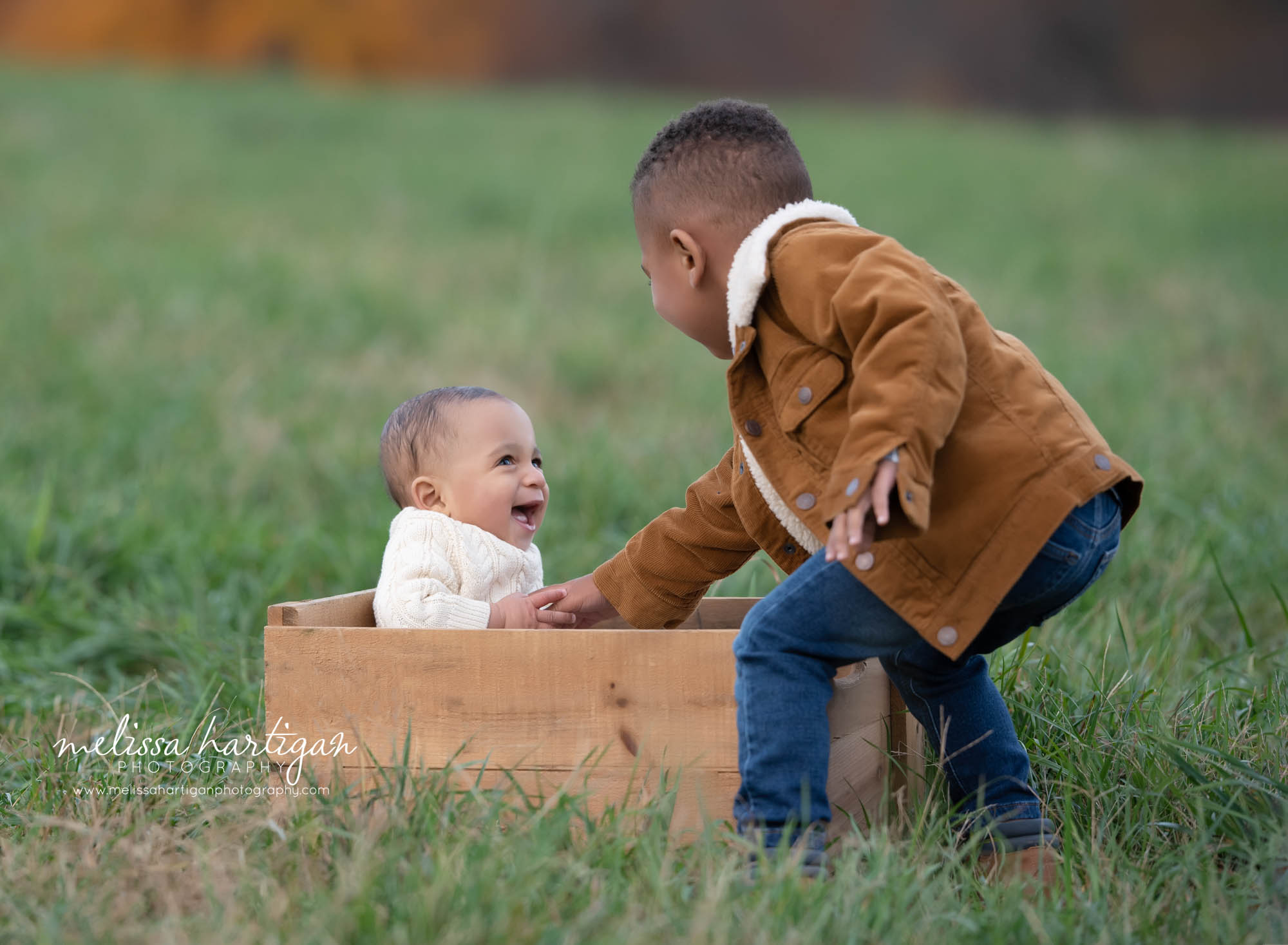 big brother making baby brother laugh family photography CT