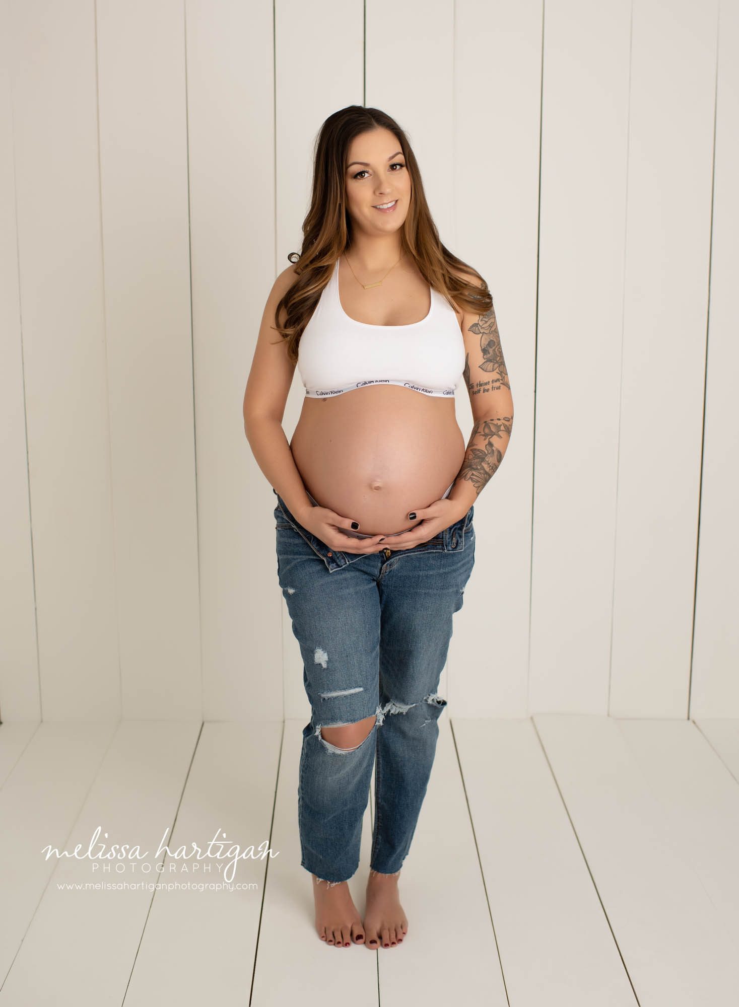 mom holding under belly studio maternity photography pose hartford county maternity photographer