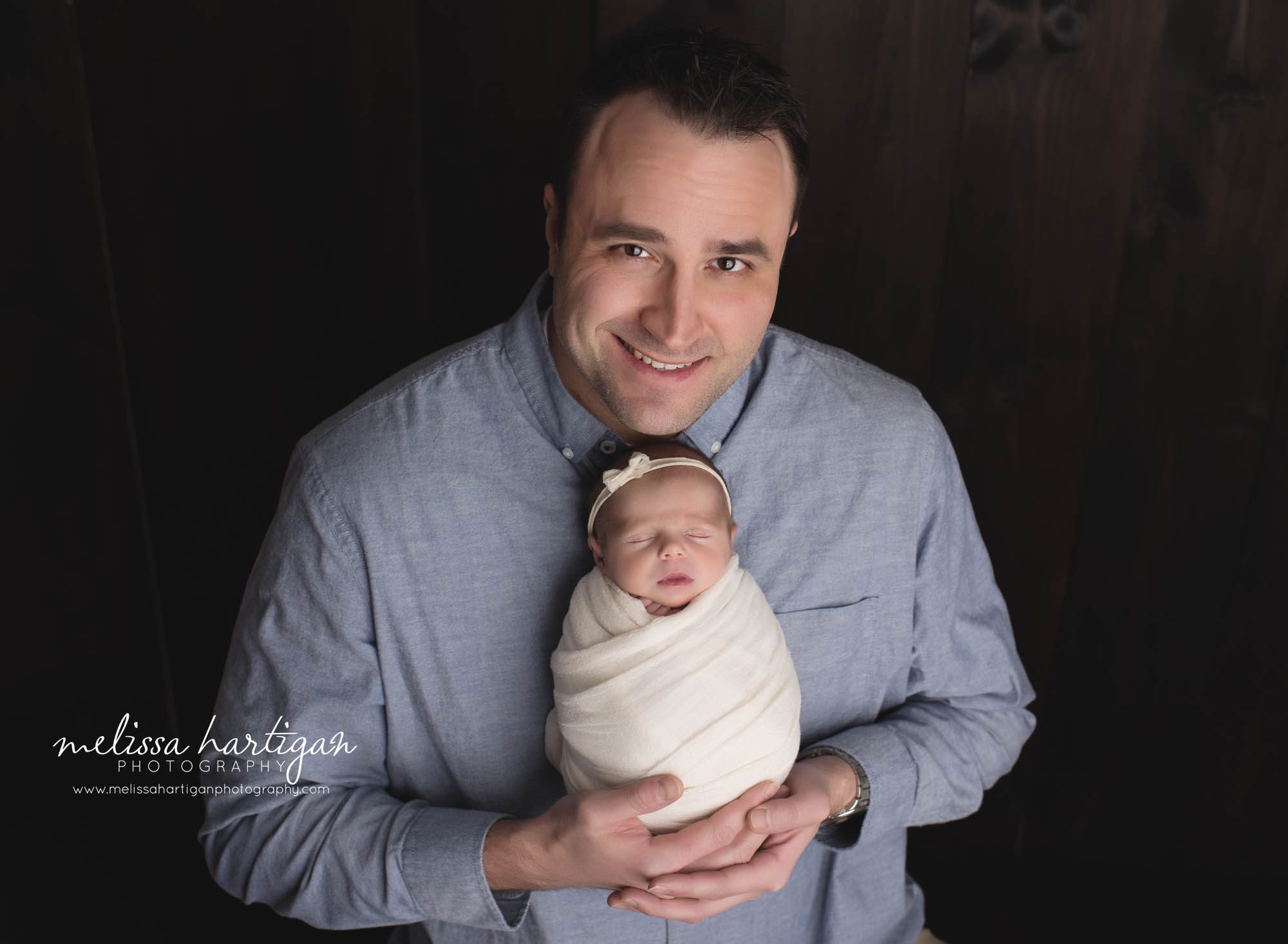 dad holding newborn daughter parent pose studio newborn photography session coventry CT