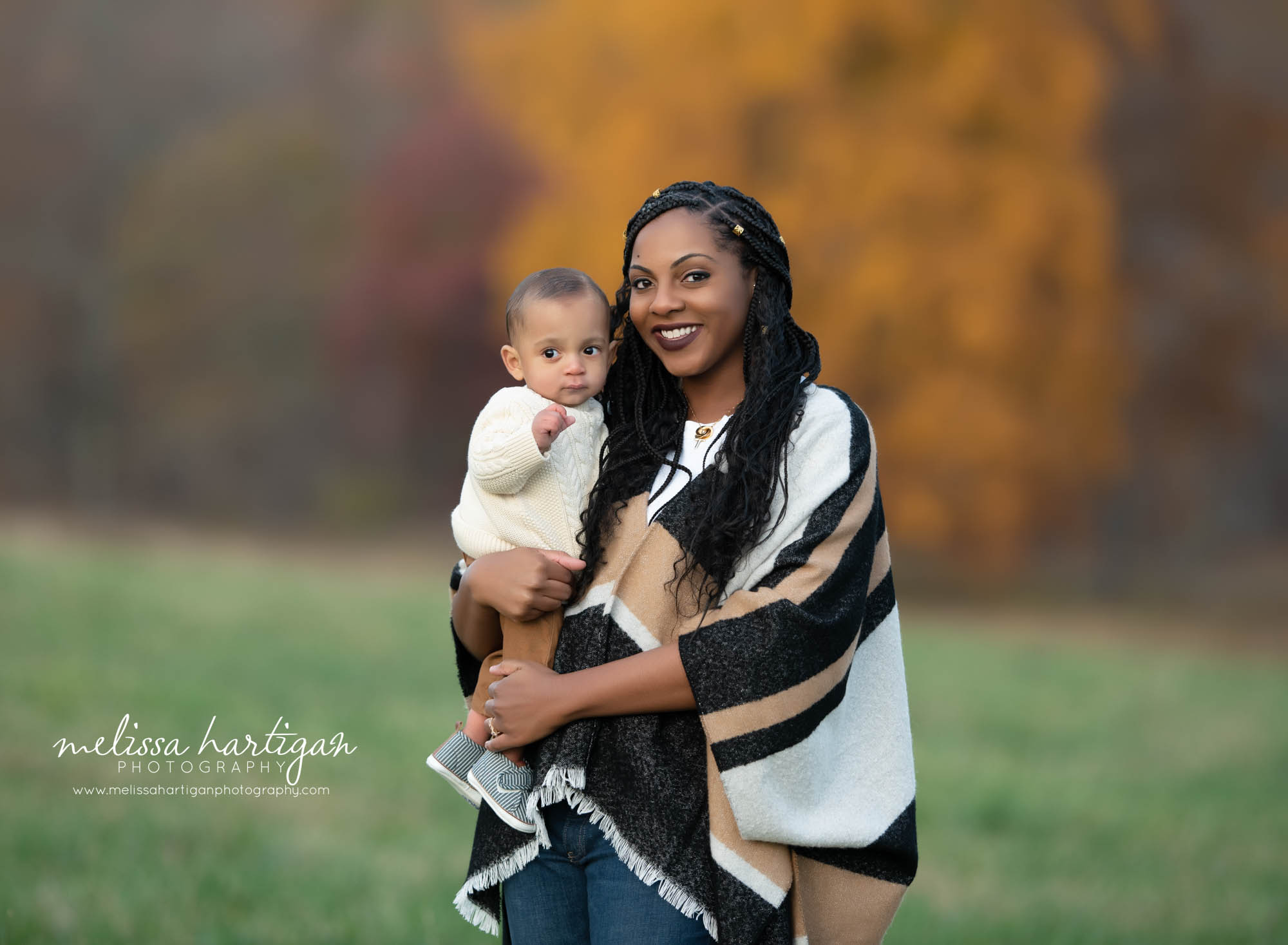 mom holding baby son outside family photography CT pose