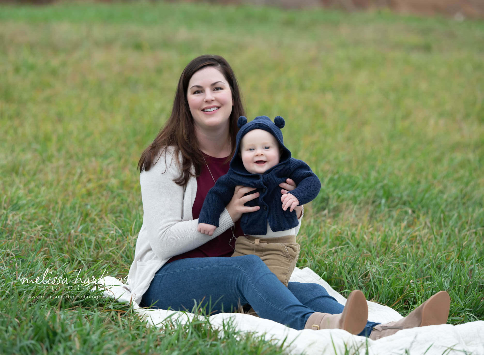 mom and baby son sitting on blanket connecticut family photography
