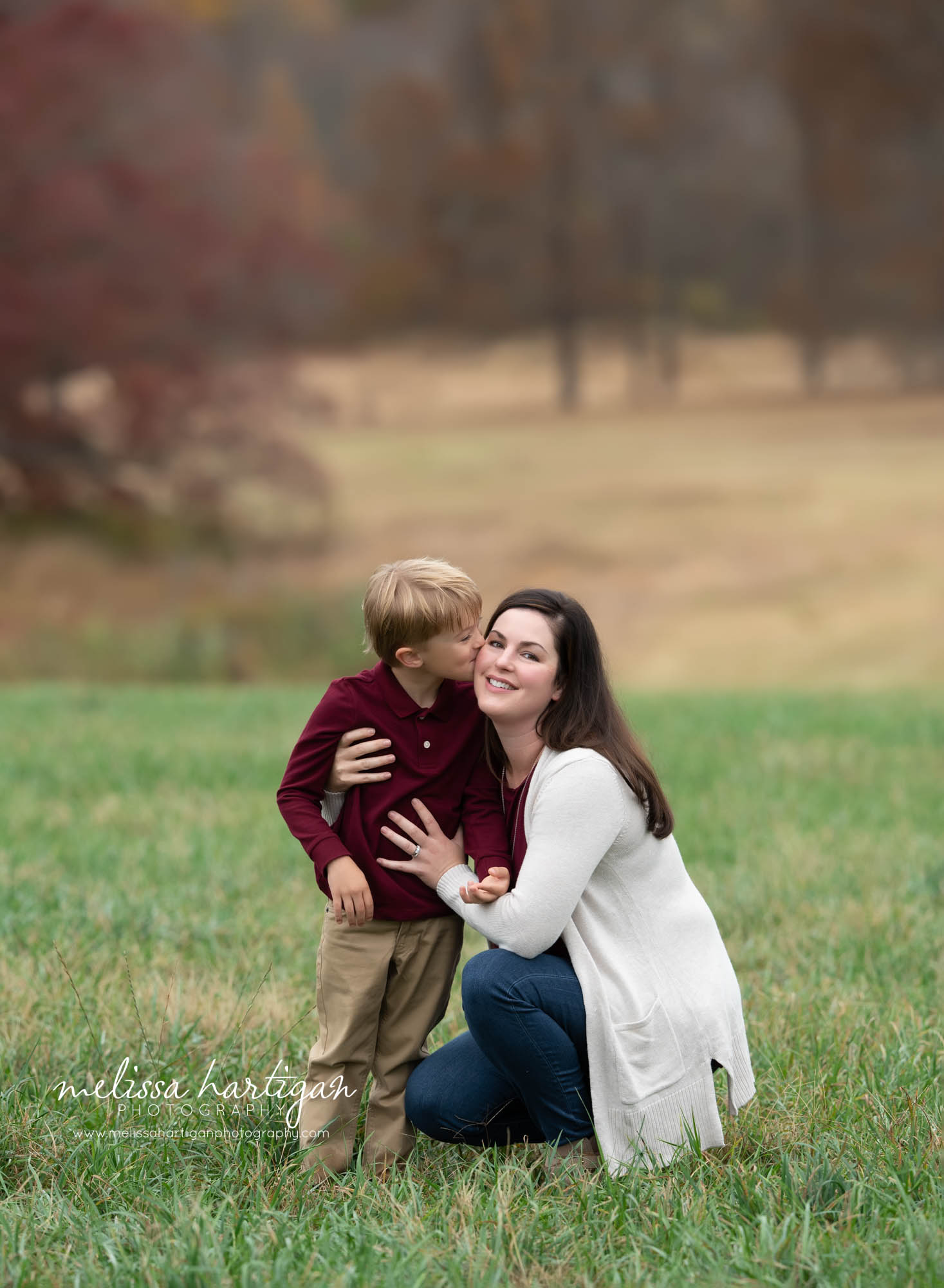 mom and son, son kissing mom on cheek family photography session CT photographer
